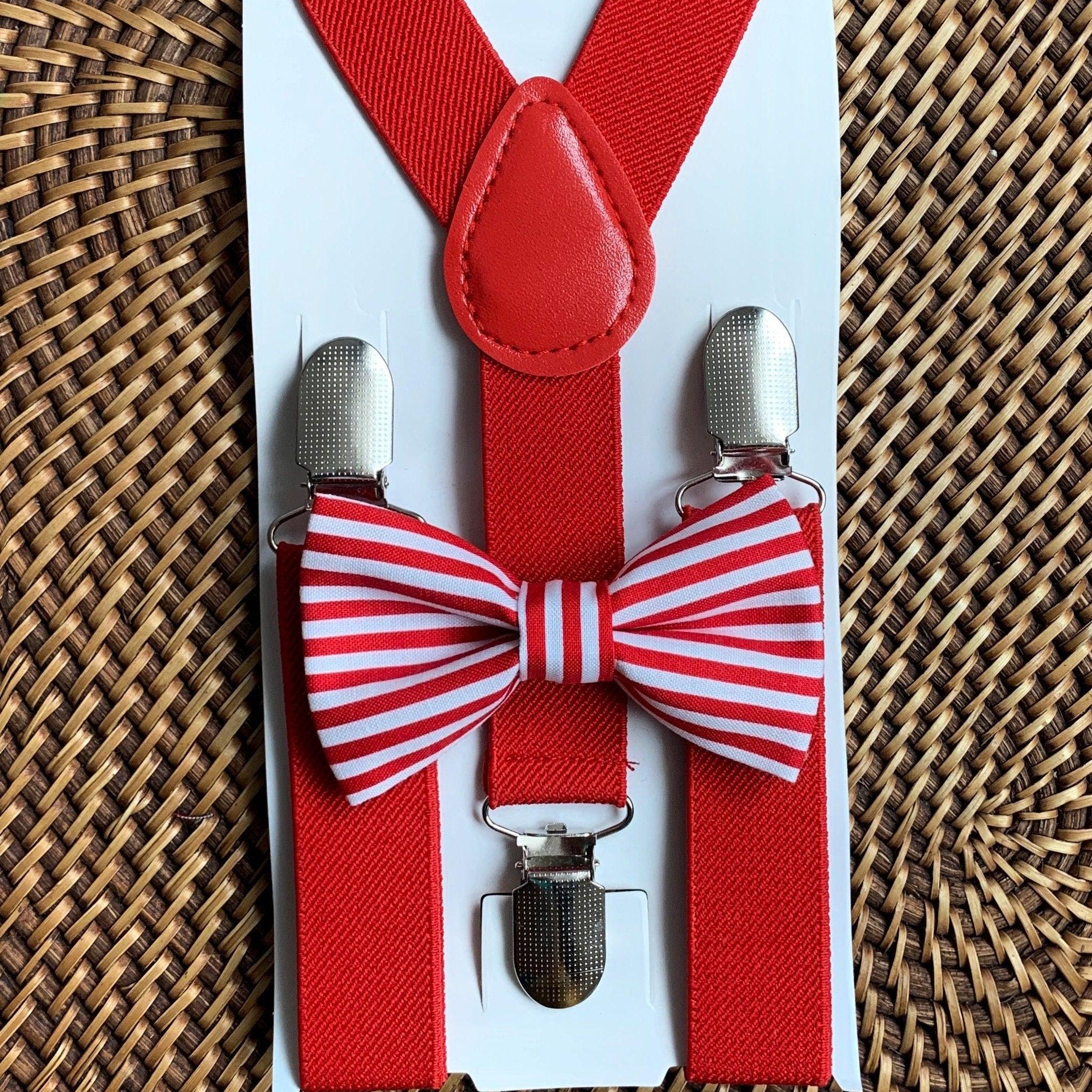 The Bold Bow Tie size chart for bow tie and suspender sets showing Small, Medium, Adult, and Big & Tall sizes with typical age ranges, suspender lengths, and bow tie widths. Small fits ages 6 months–6 years with 18–29 inch suspenders and a 3.5 inch bow tie; Medium fits ages 7–12 years with 25.5–40 inch suspenders and a 4 inch bow tie; Adult fits ages 13 years–6 feet tall with 25.5–40 inch suspenders and a 4.5 inch bow tie; Big & Tall fits over 6 feet tall with 31–53 inch suspenders and a 4.5 inch bow tie.