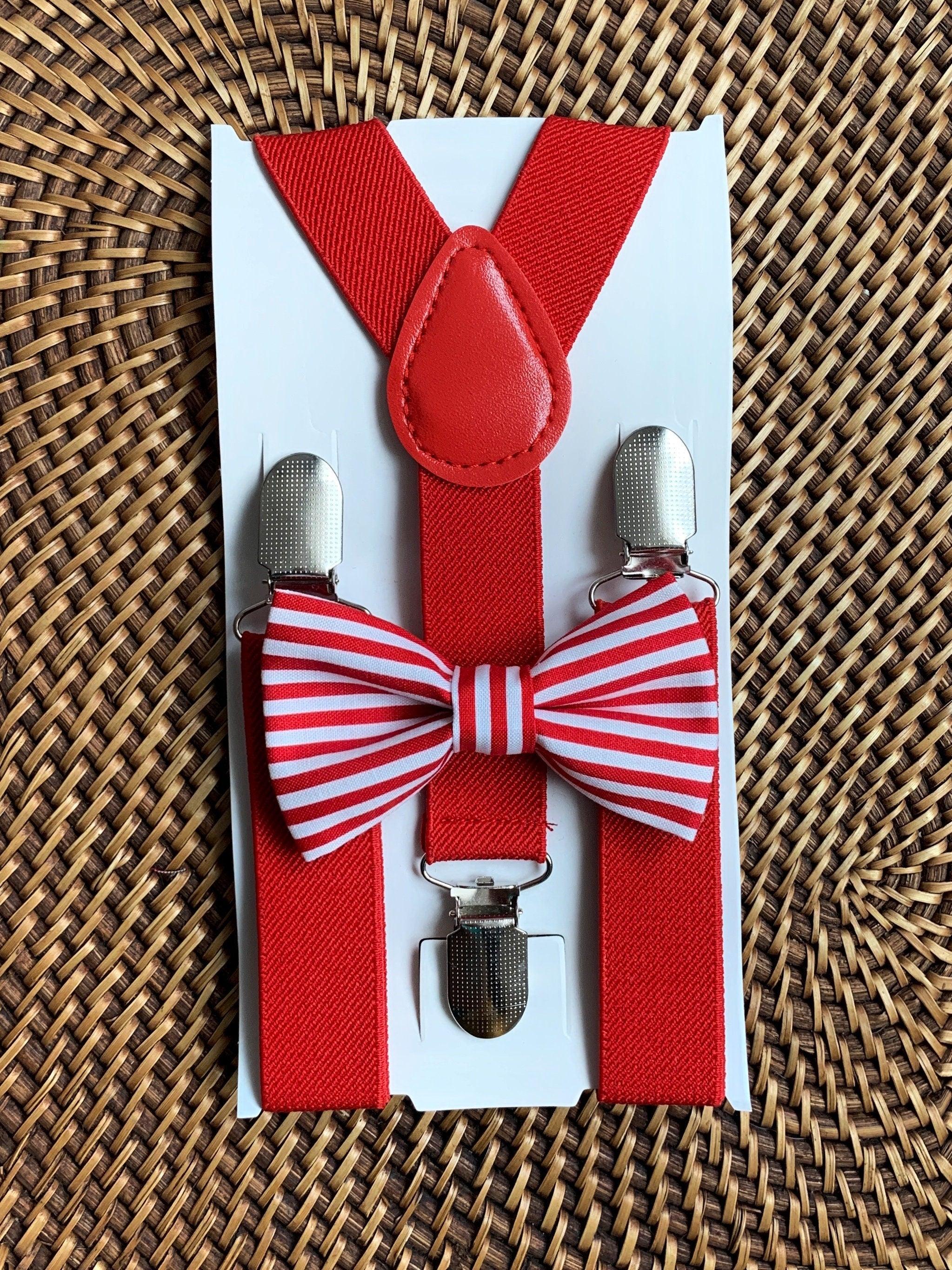 The Bold Bow Tie size chart for bow tie and suspender sets showing Small, Medium, Adult, and Big & Tall sizes with typical age ranges, suspender lengths, and bow tie widths. Small fits ages 6 months–6 years with 18–29 inch suspenders and a 3.5 inch bow tie; Medium fits ages 7–12 years with 25.5–40 inch suspenders and a 4 inch bow tie; Adult fits ages 13 years–6 feet tall with 25.5–40 inch suspenders and a 4.5 inch bow tie; Big & Tall fits over 6 feet tall with 31–53 inch suspenders and a 4.5 inch bow tie.