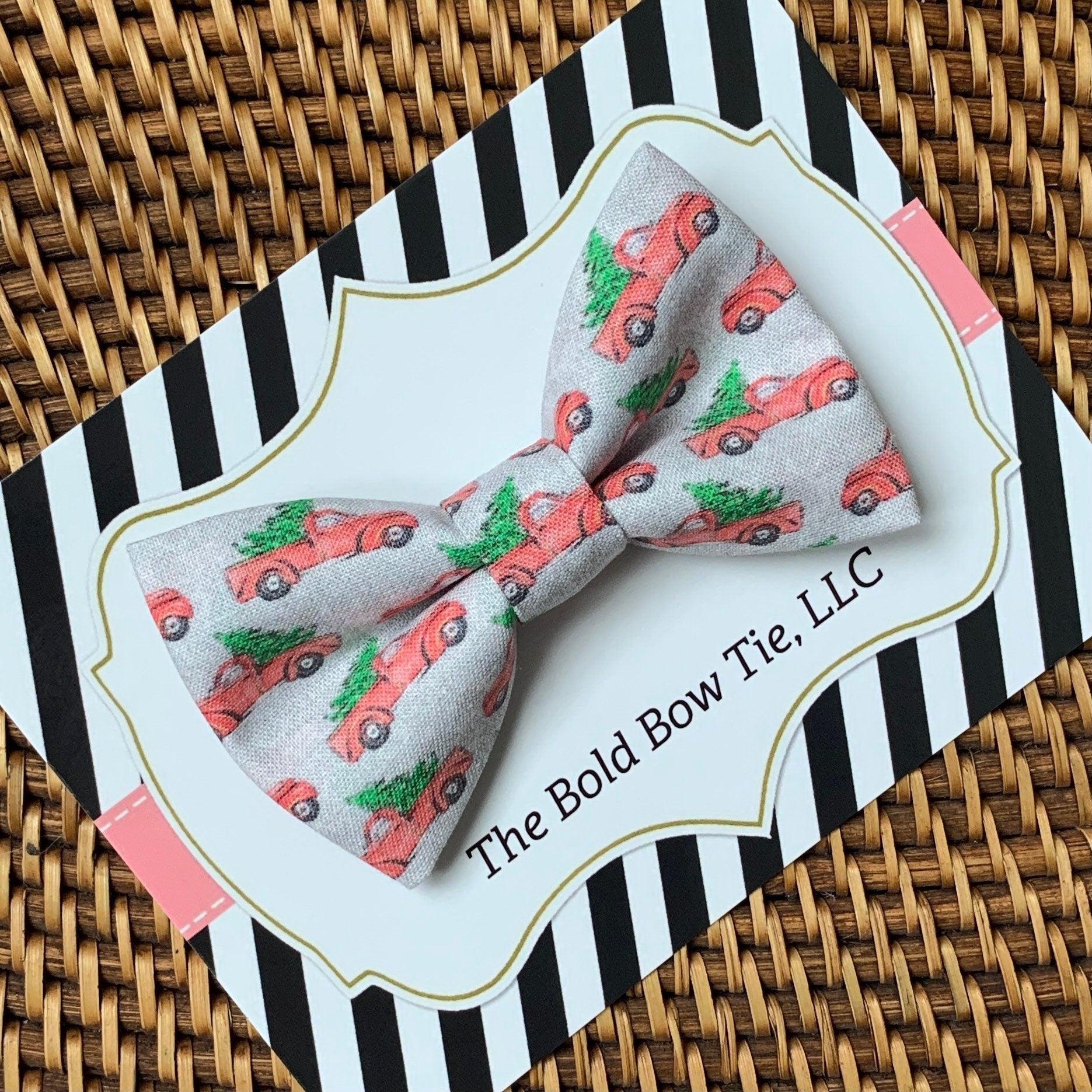 Dog bow tie size chart. Size Small is 3 1/2 inches wide for small dogs under 15 lbs. Size Medium is 4 inches wide for medium dogs between 15 band 40 lbs. Size Large is 4 1/2 inches wide for Large Dogs between 40 band 80 lbs. Size Extra Large is 5 1/2 inches wide for Extra Large Dogs over 80 lbs. Sizing is up to preference and pet bow ties slide on to dog collars with elastic.