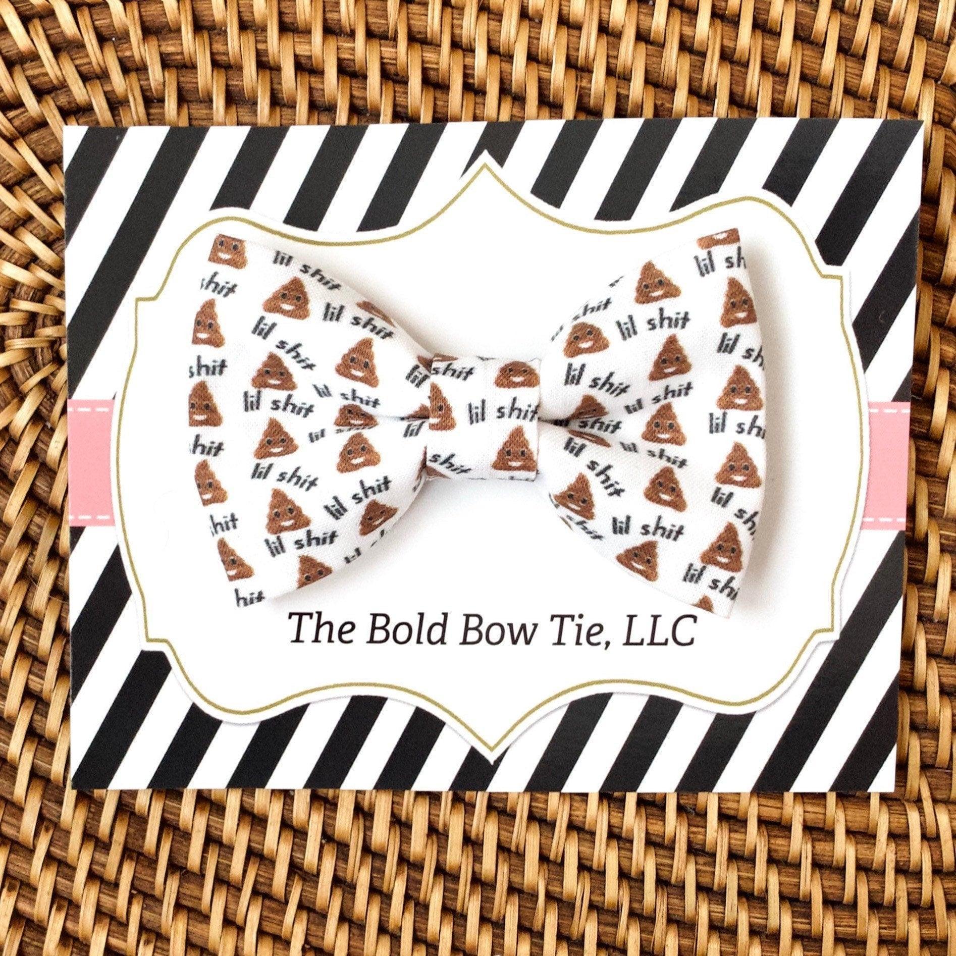 Poop Emoji Bow Tie for dog and cat collars featuring repeating poop emoji pattern on white fabric mounted on striped packaging