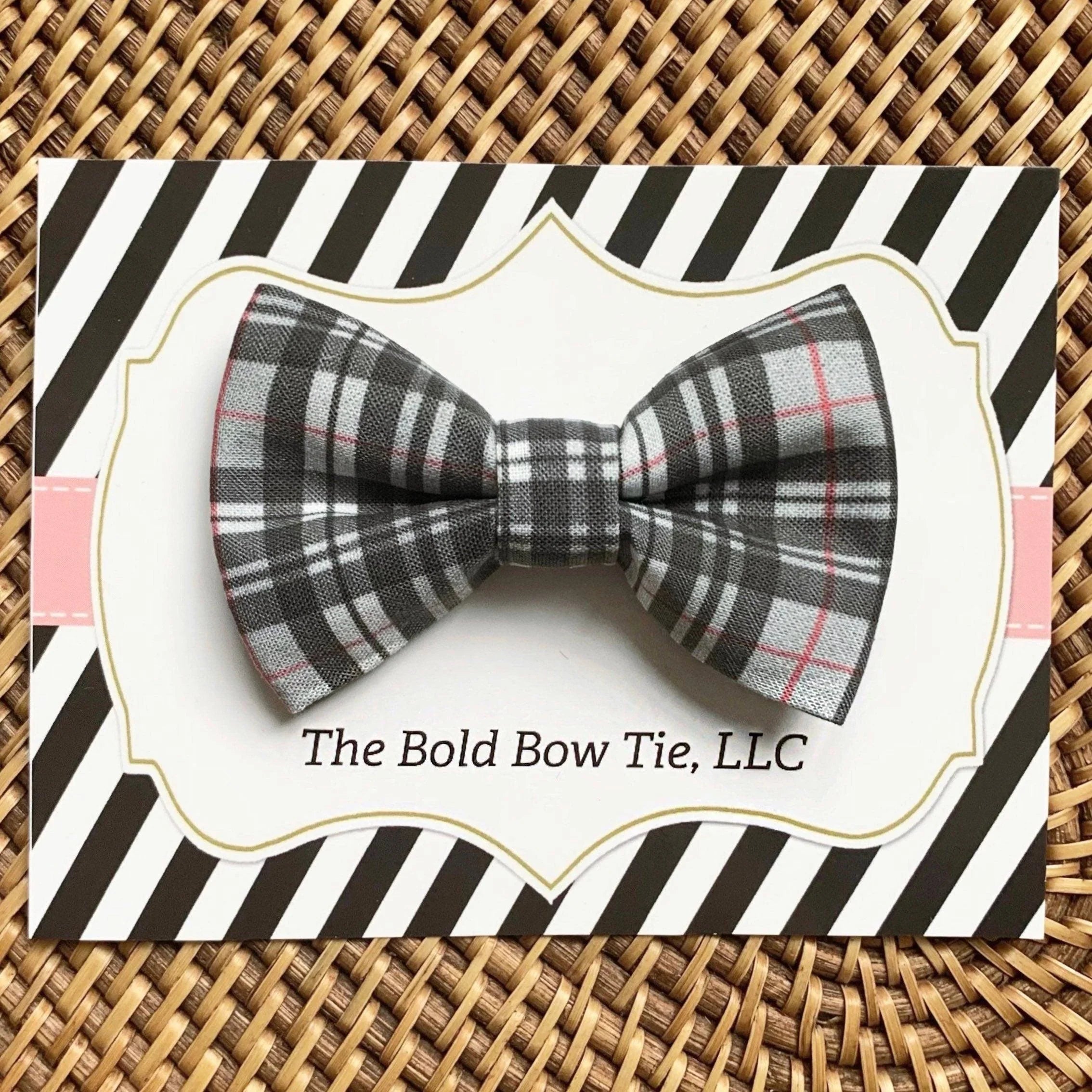 Grey plaid bow tie for dog or cat collars displayed on a white decorative card