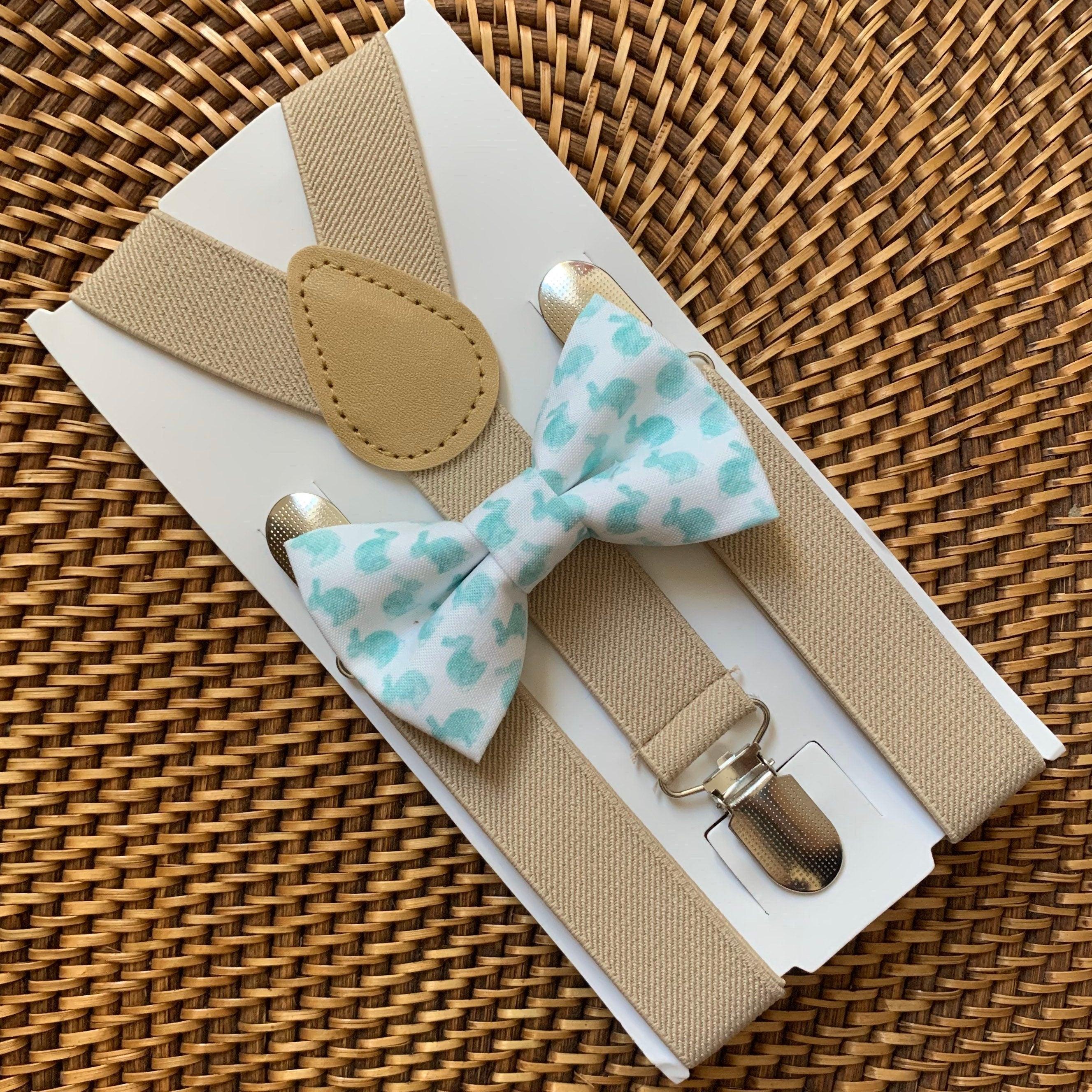 Blue watercolor Easter bunny bow tie with tan suspenders displayed on packaging.
