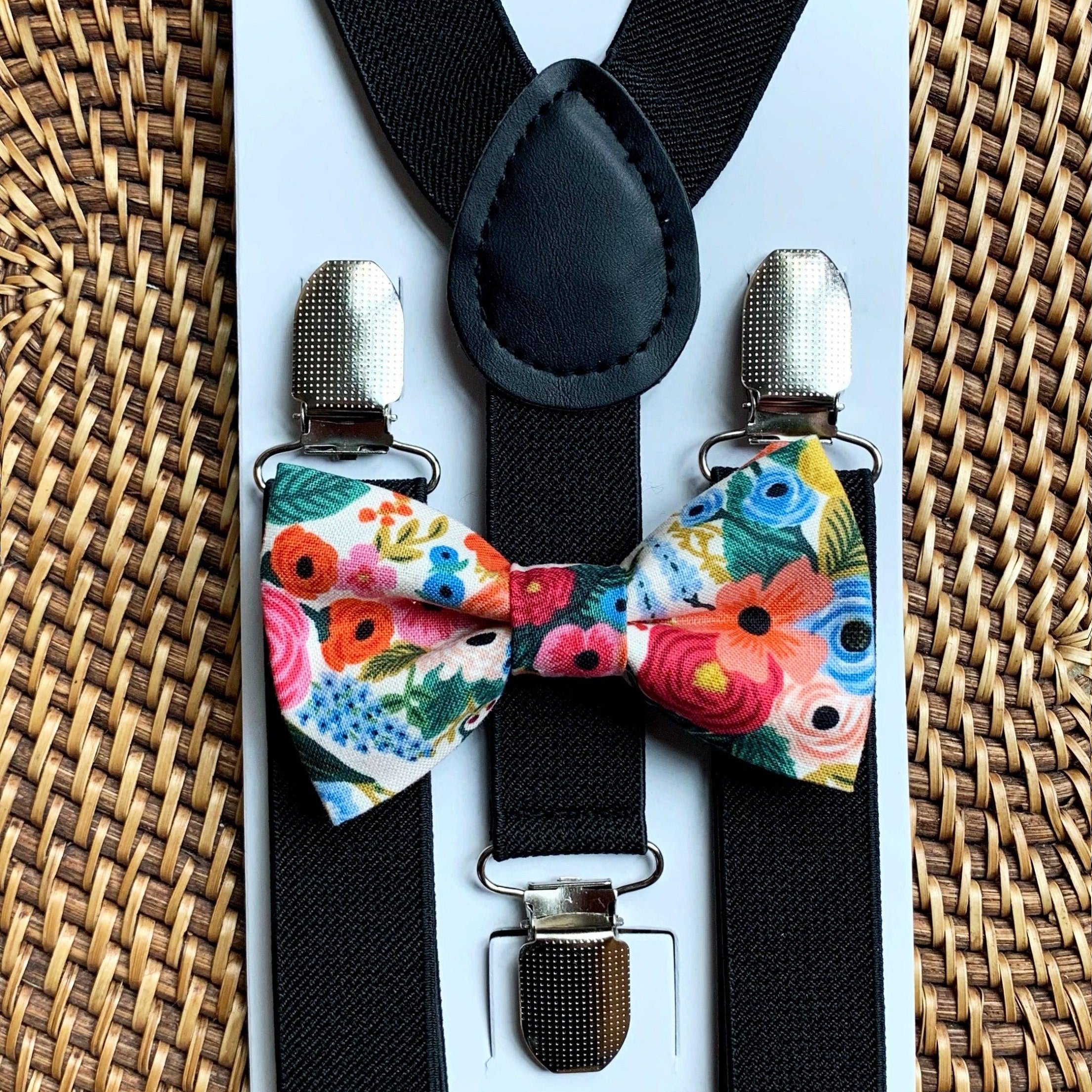 Floral bow tie and black suspenders.