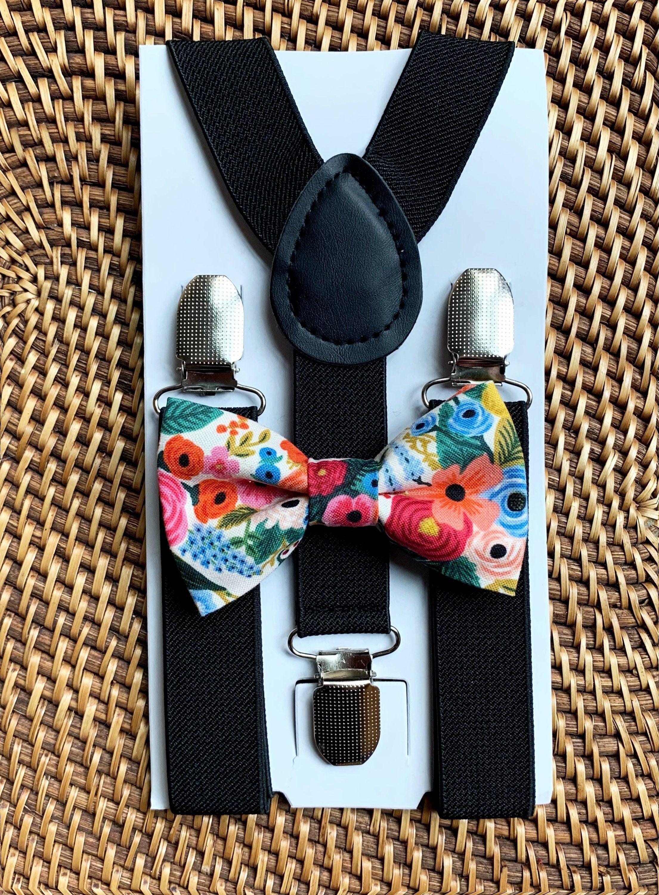 Floral bow tie and black suspenders.