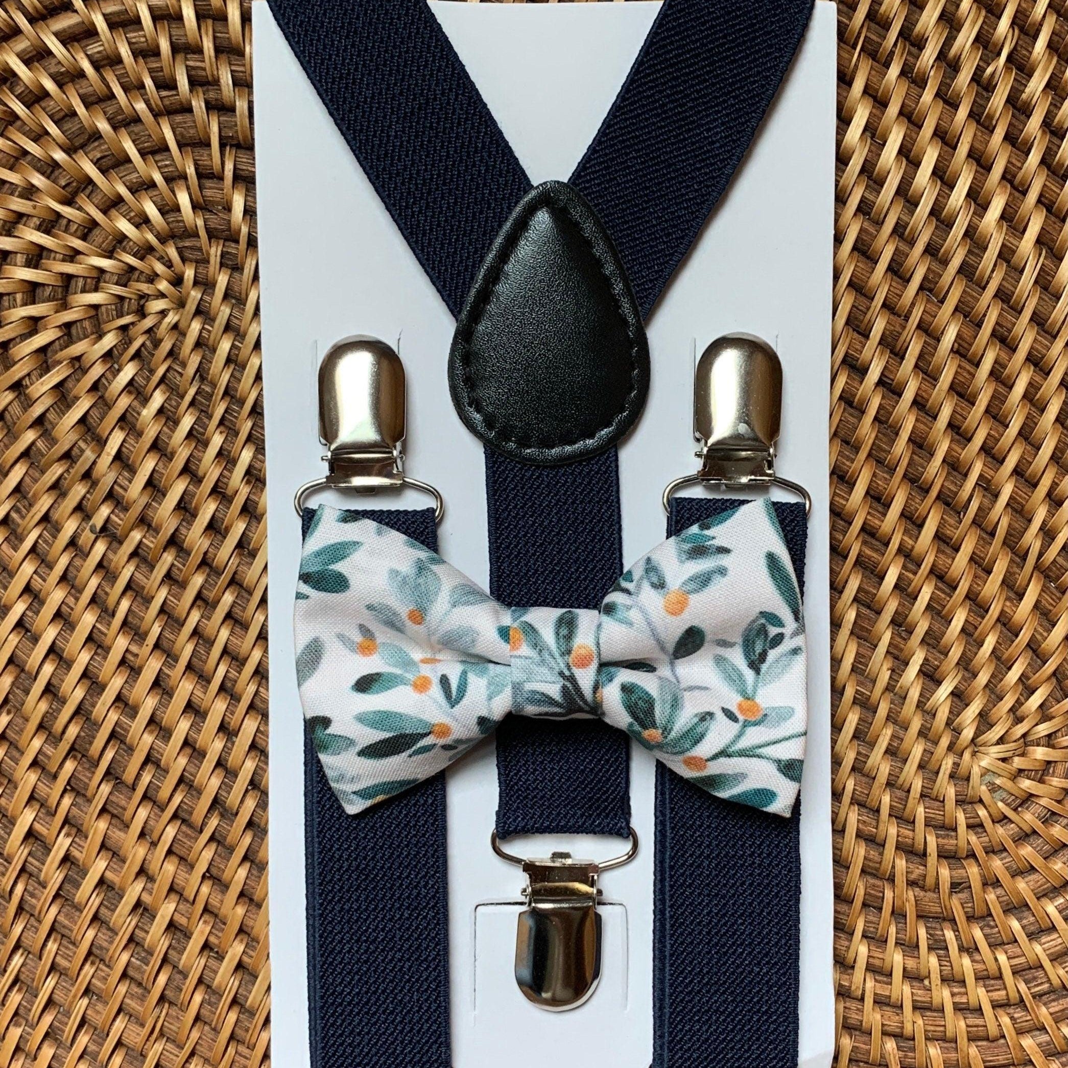 Size chart for suspender and bow tie sets from The Bold Bow Tie. Small (6mo-6yr): 18"-29" suspenders, 3.5" bow. Medium (7-12yr): 25.5"-40" suspenders, 4" bow. Adult (13yr-6ft tall): 25.5"-40" suspenders, 4.5" bow. Big & Tall (Over 6ft tall): 31"-53" suspenders, 4.5" bow. Instructions note to measure from the back waistband over the shoulder to the front waistband for a comfortable fit.