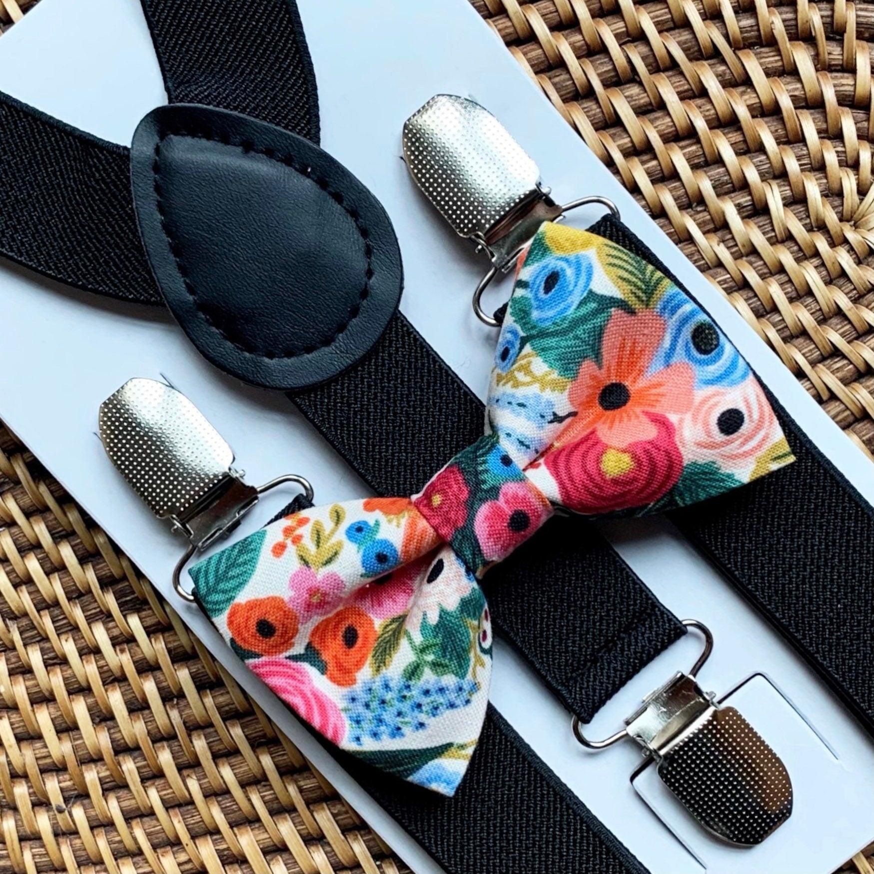 Floral bow tie and black suspenders.