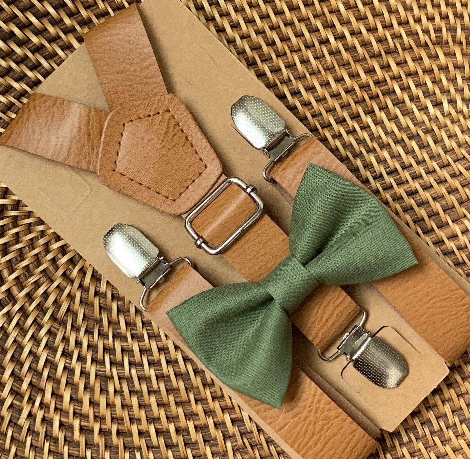 Olive bow tie with tan vegan leather suspenders and metal hardware on kraft backing