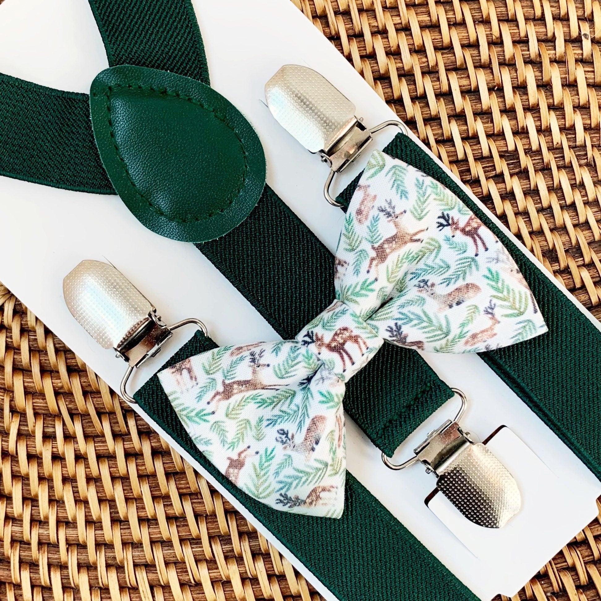 Christmas bow tie with deer and dark green suspenders.