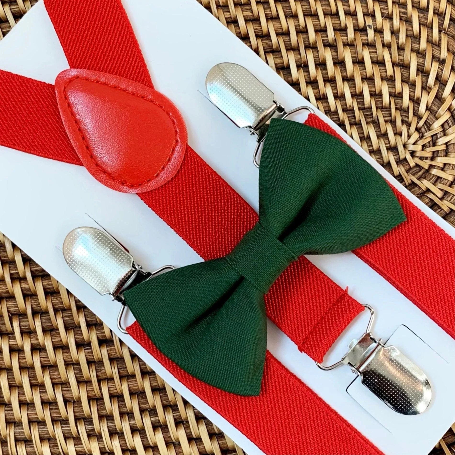 Christmas green bow tie and Red suspenders on a white background