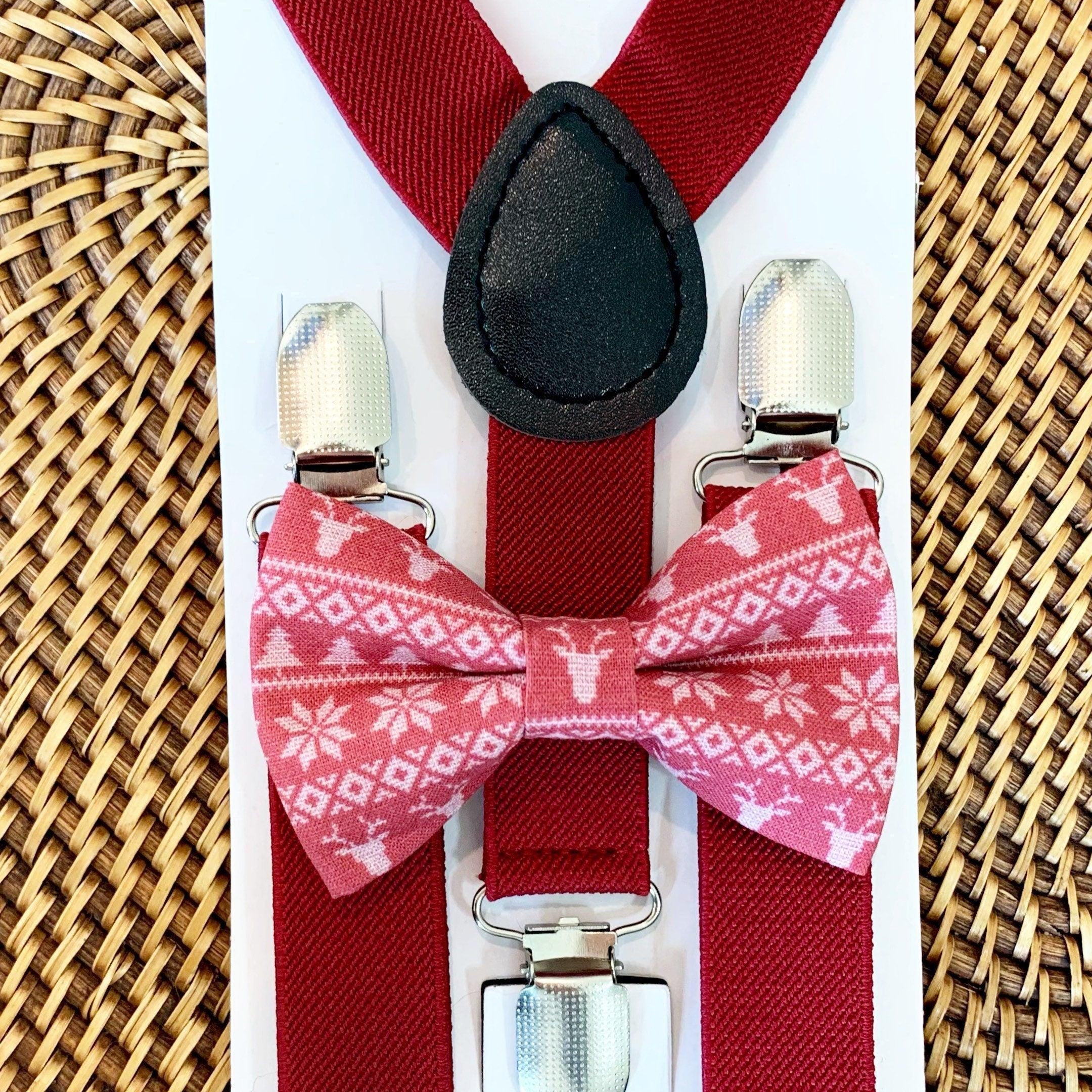 The Bold Bow Tie size chart for bow tie and suspender sets showing Small, Medium, Adult, and Big & Tall sizes with typical age ranges, suspender lengths, and bow tie widths. Small fits ages 6 months–6 years with 18–29 inch suspenders and a 3.5 inch bow tie; Medium fits ages 7–12 years with 25.5–40 inch suspenders and a 4 inch bow tie; Adult fits ages 13 years–6 feet tall with 25.5–40 inch suspenders and a 4.5 inch bow tie; Big & Tall fits over 6 feet tall with 31–53 inch suspenders and a 4.5 inch bow tie.