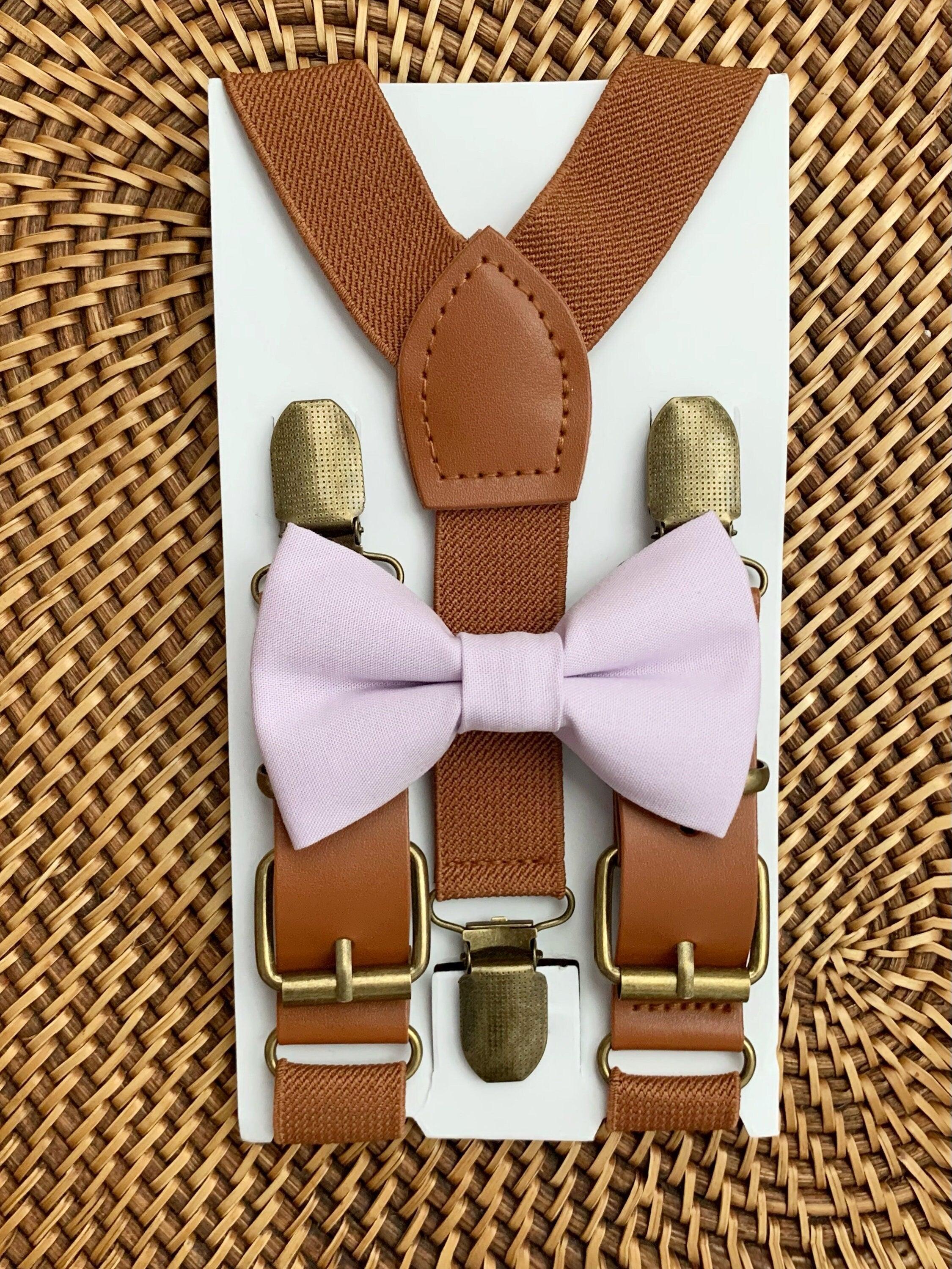Size chart for suspender and bow tie sets from The Bold Bow Tie. X-Small (6mo-4yr): 15"-23" suspenders, 3.5" bow. Small (5-9yr): 18"-33" suspenders, 3.5" bow. Medium (10-12yr): 18"-33" suspenders, 4" bow. Adult (13yr-6'5"): 30"-53" suspenders, 4.5" bow. Big & Tall (Over 6'5"): 53"+ suspenders, 4.5" bow. Instructions note to measure from the back waistband over the shoulder to the front waistband for a comfortable fit.