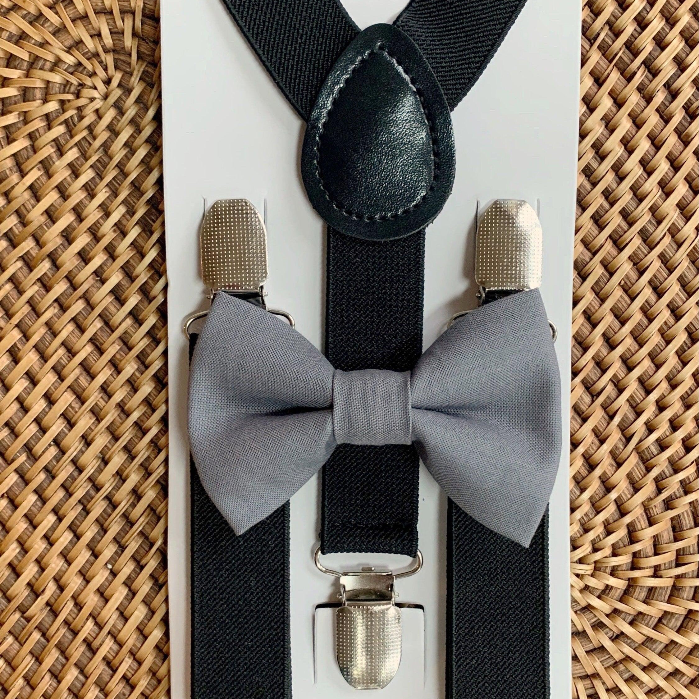 The Bold Bow Tie size chart for bow tie and suspender sets showing Small, Medium, Adult, and Big & Tall sizes with typical age ranges, suspender lengths, and bow tie widths. Small fits ages 6 months–6 years with 18–29 inch suspenders and a 3.5 inch bow tie; Medium fits ages 7–12 years with 25.5–40 inch suspenders and a 4 inch bow tie; Adult fits ages 13 years–6 feet tall with 25.5–40 inch suspenders and a 4.5 inch bow tie; Big & Tall fits over 6 feet tall with 31–53 inch suspenders and a 4.5 inch bow tie.
