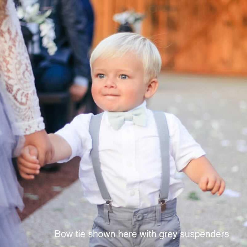 Toddler bow tie in sage green worn by a ring bearer.