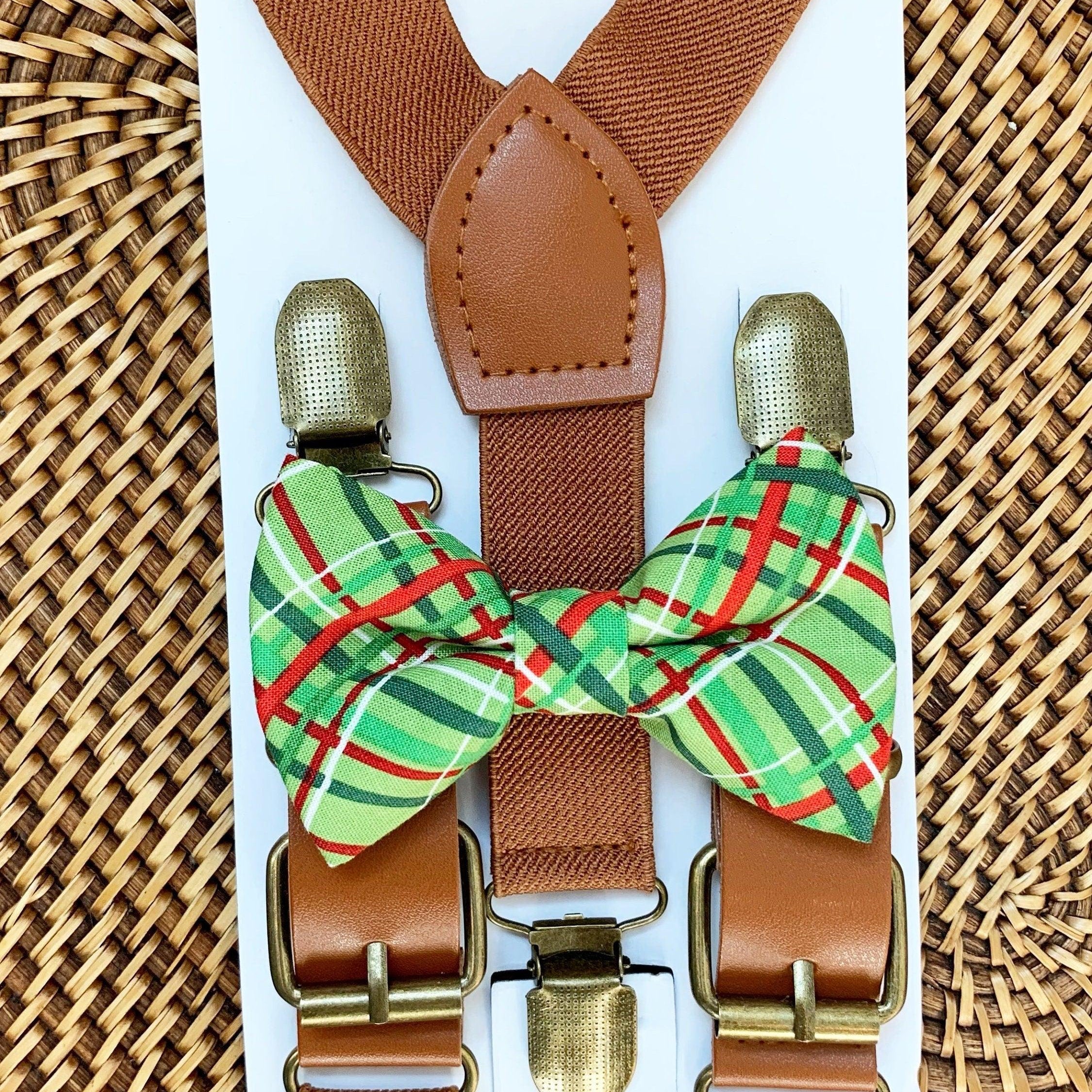 Size chart for suspender and bow tie sets from The Bold Bow Tie. X-Small (6mo-4yr): 15"-23" suspenders, 3.5" bow. Small (5-9yr): 18"-33" suspenders, 3.5" bow. Medium (10-12yr): 18"-33" suspenders, 4" bow. Adult (13yr-6'5"): 30"-53" suspenders, 4.5" bow. Big & Tall (Over 6'5"): 53"+ suspenders, 4.5" bow. Instructions note to measure from the back waistband over the shoulder to the front waistband for a comfortable fit.