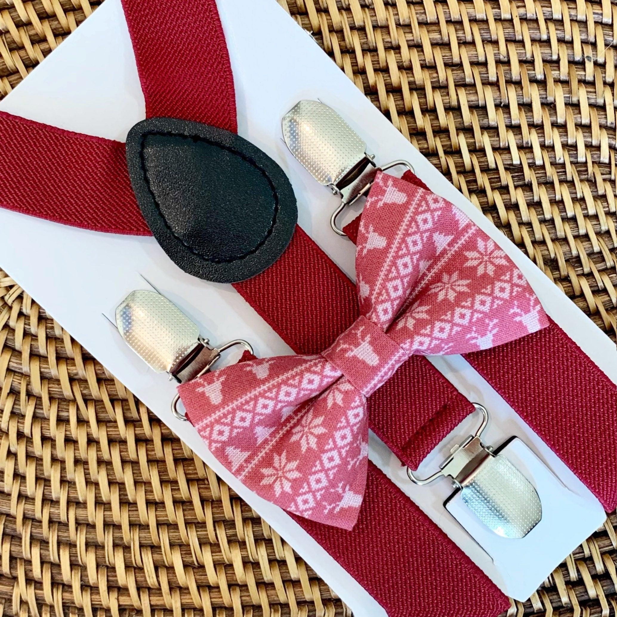 Red Christmas bow tie with burgundy suspenders laid out as a set