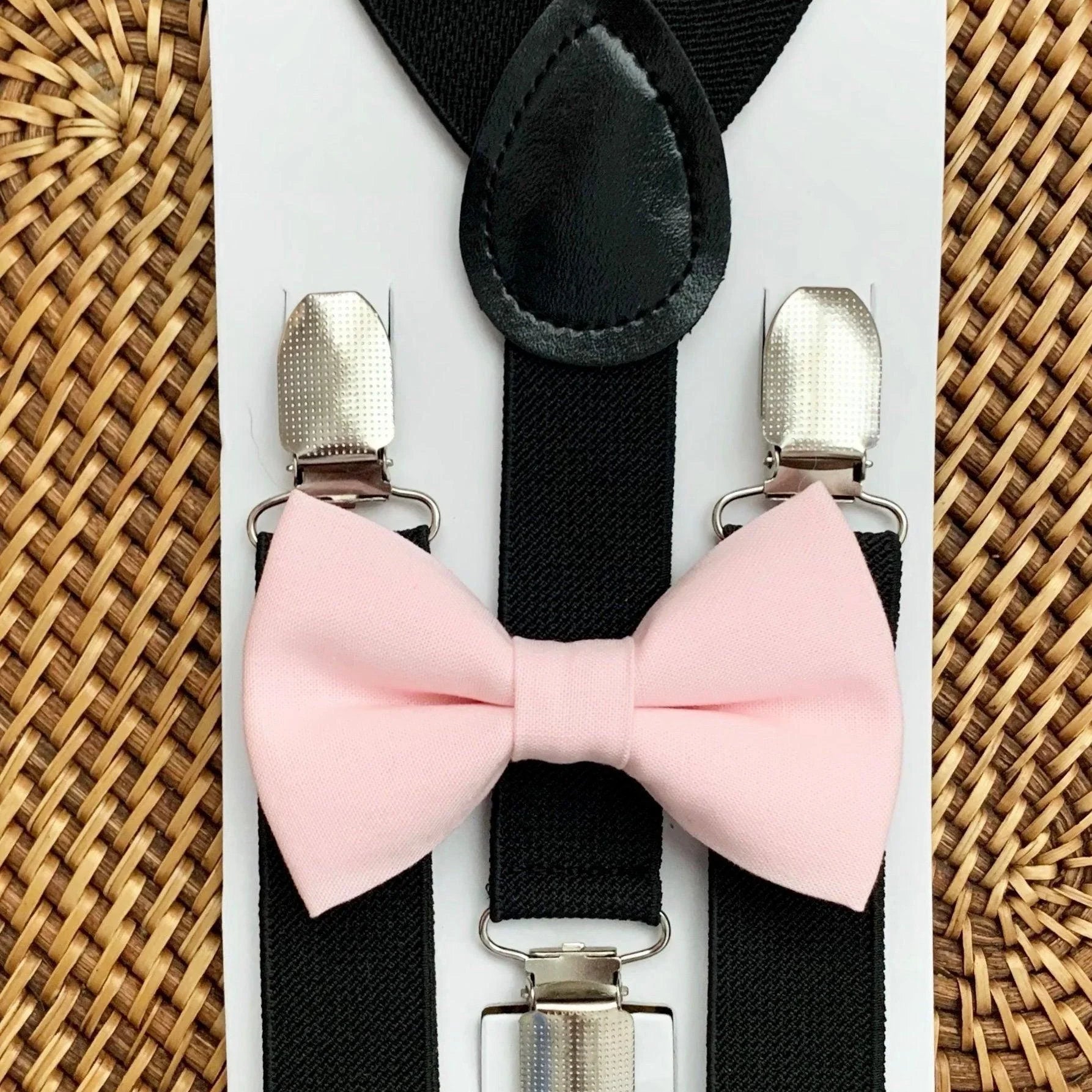 Size chart for suspender and bow tie sets from The Bold Bow Tie. Small (6mo-6yr): 18"-29" suspenders, 3.5" bow. Medium (7-12yr): 25.5"-40" suspenders, 4" bow. Adult (13yr-6ft tall): 25.5"-40" suspenders, 4.5" bow. Big & Tall (Over 6ft tall): 31"-53" suspenders, 4.5" bow. Instructions note to measure from the back waistband over the shoulder to the front waistband for a comfortable fit.