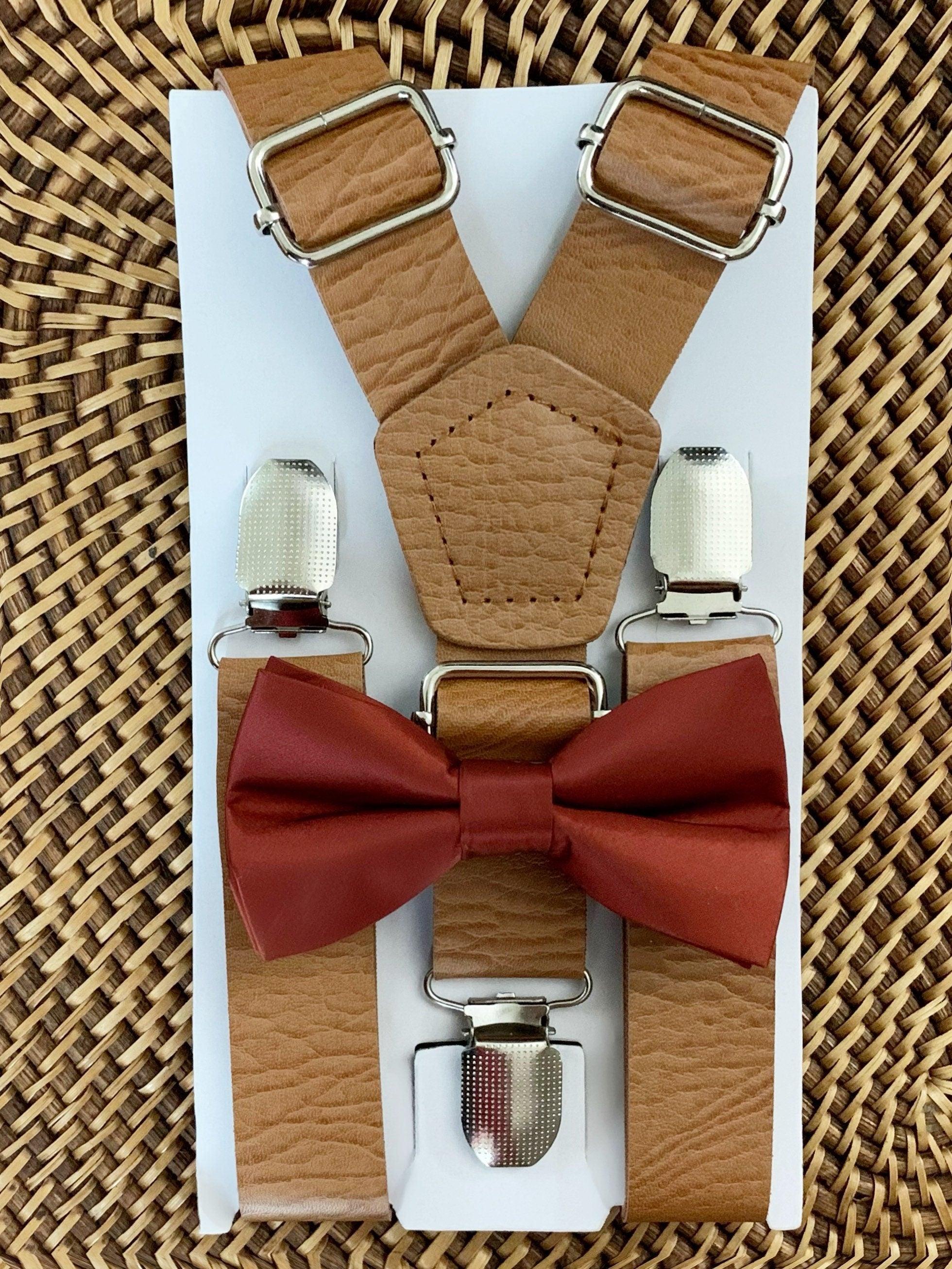 Cinnamon bow tie and brown vegan leather suspenders.
