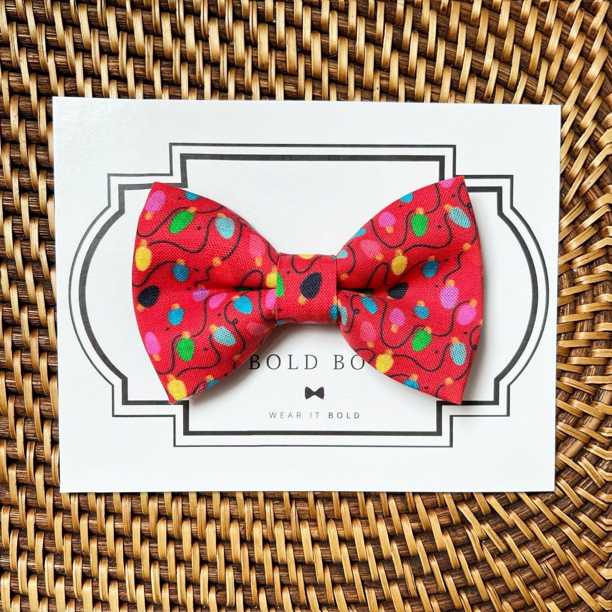 Dog bow tie size chart. Size Small is 3 1/2 inches wide for small dogs under 15 lbs. Size Medium is 4 inches wide for medium dogs between 15 band 40 lbs. Size Large is 4 1/2 inches wide for Large Dogs between 40 band 80 lbs. Size Extra Large is 5 1/2 inches wide for Extra Large Dogs over 80 lbs. Sizing is up to preference and pet bow ties slide on to dog collars with elastic.
