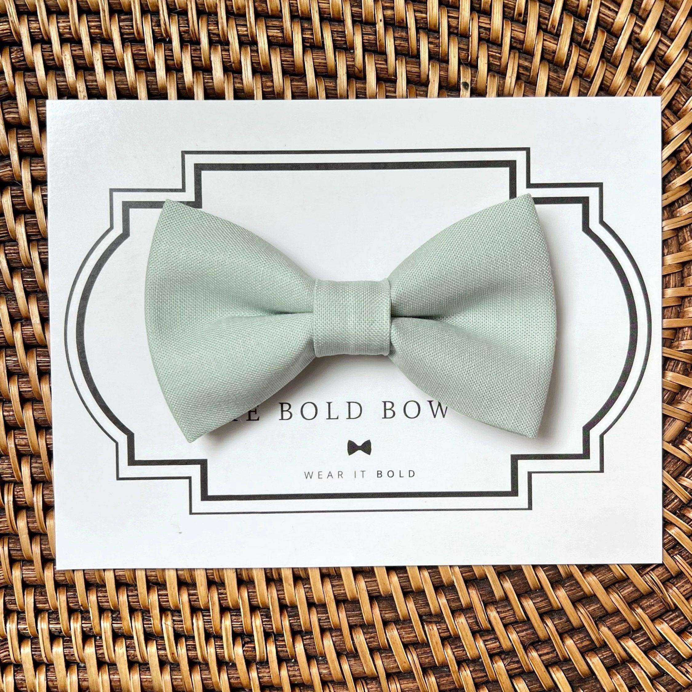 Dog bow tie size chart. Size Small is 3 1/2 inches wide for small dogs under 15 lbs. Size Medium is 4 inches wide for medium dogs between 15 band 40 lbs. Size Large is 4 1/2 inches wide for Large Dogs between 40 band 80 lbs. Size Extra Large is 5 1/2 inches wide for Extra Large Dogs over 80 lbs. Sizing is up to preference and pet bow ties slide on to dog collars with elastic.
