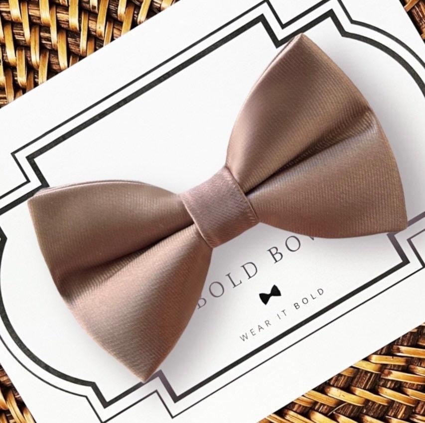 Bow Size Chart: Large: 4 1/2 inches wide by 2 1/2 inches tall Medium: 4 inches wide by 2 1/2 inches tall Small: 3 inches wide by 2 inches tall
