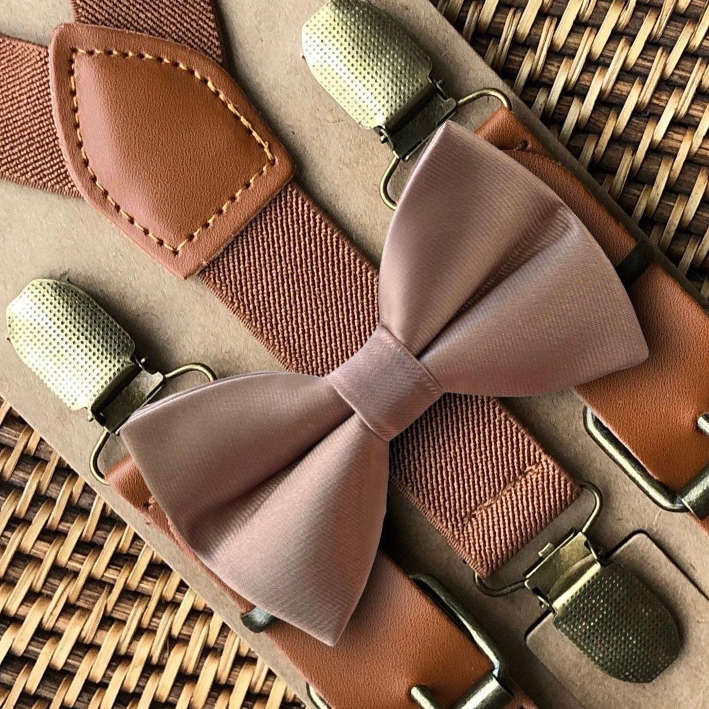 Size chart for suspender and bow tie sets from The Bold Bow Tie. X-Small (6mo-4yr): 15"-23" suspenders, 3.5" bow. Small (5-9yr): 18"-33" suspenders, 3.5" bow. Medium (10-12yr): 18"-33" suspenders, 4" bow. Adult (13yr-6'5"): 30"-53" suspenders, 4.5" bow. Big & Tall (Over 6'5"): 53"+ suspenders, 4.5" bow. Instructions note to measure from the back waistband over the shoulder to the front waistband for a comfortable fit.