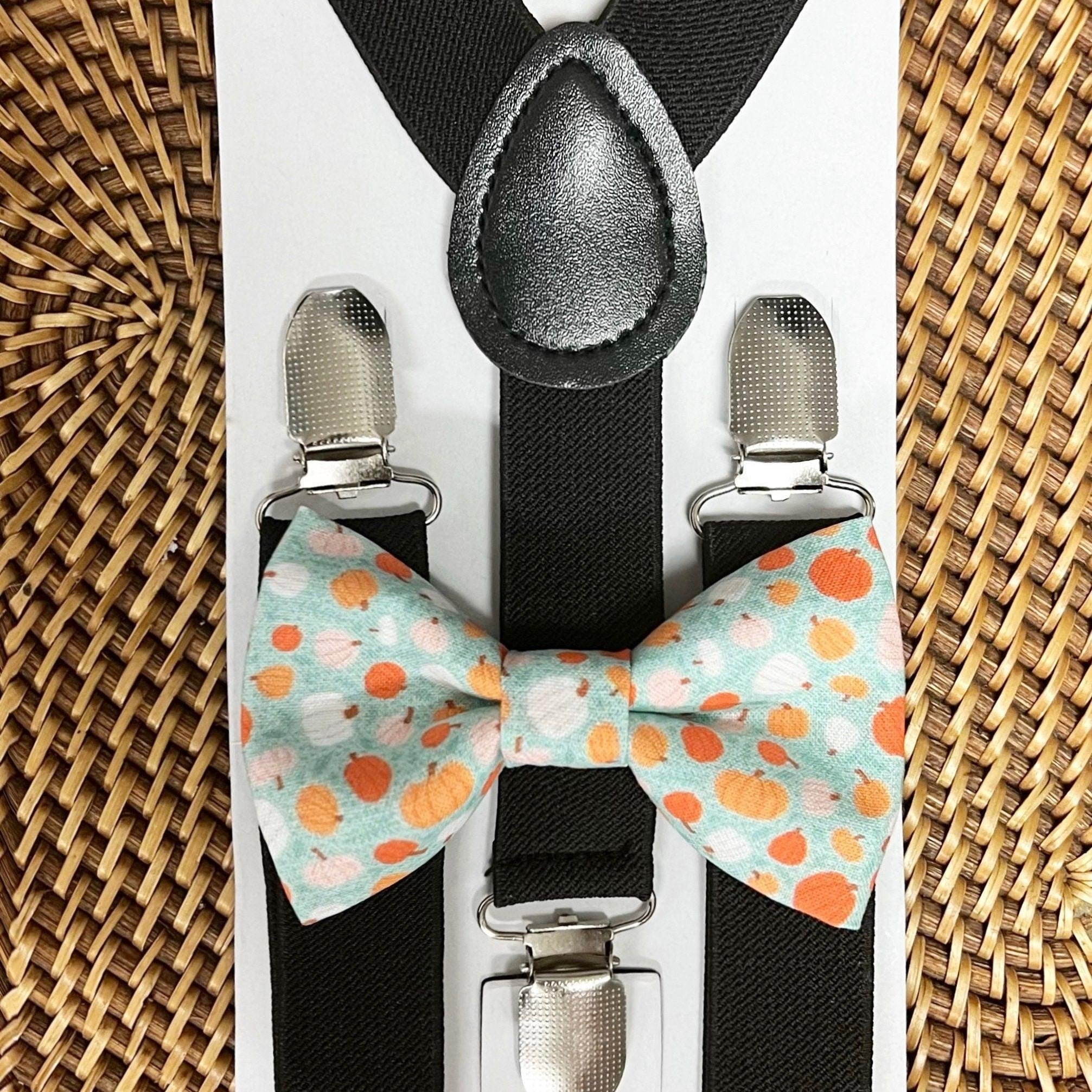 The Bold Bow Tie size chart for bow tie and suspender sets showing Small, Medium, Adult, and Big & Tall sizes with typical age ranges, suspender lengths, and bow tie widths. Small fits ages 6 months–6 years with 18–29 inch suspenders and a 3.5 inch bow tie; Medium fits ages 7–12 years with 25.5–40 inch suspenders and a 4 inch bow tie; Adult fits ages 13 years–6 feet tall with 25.5–40 inch suspenders and a 4.5 inch bow tie; Big & Tall fits over 6 feet tall with 31–53 inch suspenders and a 4.5 inch bow tie.