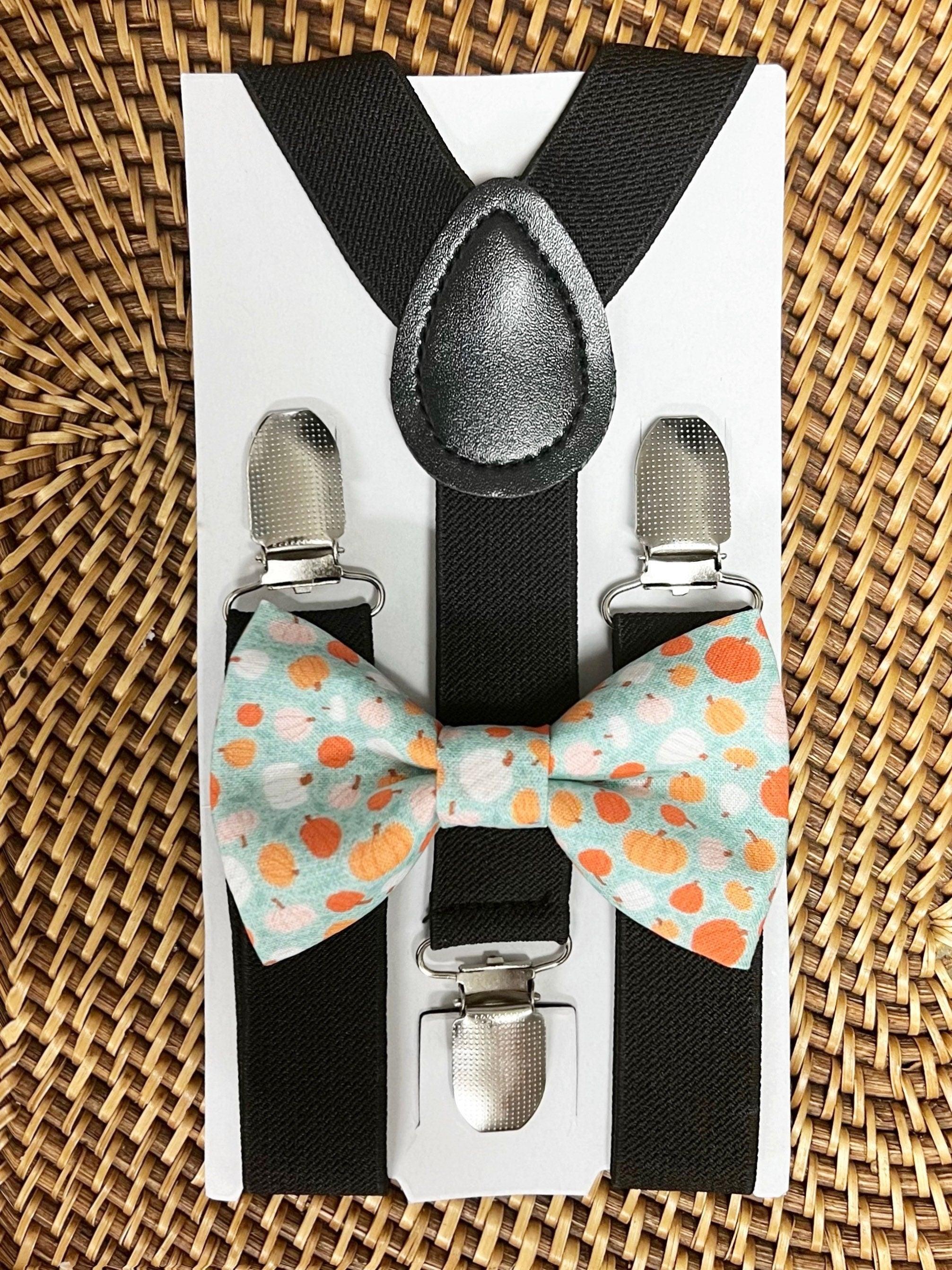 The Bold Bow Tie size chart for bow tie and suspender sets showing Small, Medium, Adult, and Big & Tall sizes with typical age ranges, suspender lengths, and bow tie widths. Small fits ages 6 months–6 years with 18–29 inch suspenders and a 3.5 inch bow tie; Medium fits ages 7–12 years with 25.5–40 inch suspenders and a 4 inch bow tie; Adult fits ages 13 years–6 feet tall with 25.5–40 inch suspenders and a 4.5 inch bow tie; Big & Tall fits over 6 feet tall with 31–53 inch suspenders and a 4.5 inch bow tie.