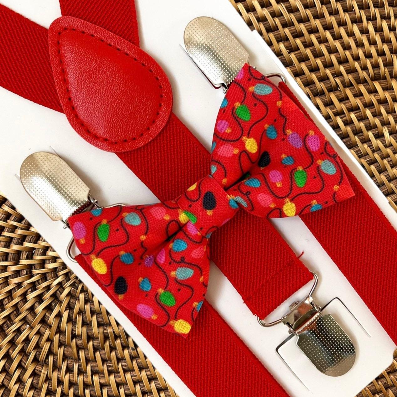 Size chart for pre-tied bow ties from The Bold Bow Tie detailing measurements across three sizes. Small is 3.5 inches wide and recommended for ages 6 months to 5 years. Medium is 4 inches wide and recommended for ages 6 to 12 years. Large is 4.5 inches wide and recommended for ages 13 years and up. Visual icons illustrate the relative sizes with horizontal arrows showing that width is measured from wingtip to wingtip. Bottom text notes that all bow ties are pre-tied and ready to add to your outfit.