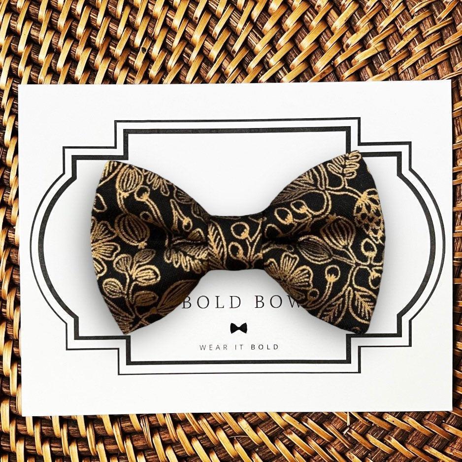 Dog bow tie size chart. Size Small is 3 1/2 inches wide for small dogs under 15 lbs. Size Medium is 4 inches wide for medium dogs between 15 band 40 lbs. Size Large is 4 1/2 inches wide for Large Dogs between 40 band 80 lbs. Size Extra Large is 5 1/2 inches wide for Extra Large Dogs over 80 lbs. Sizing is up to preference and pet bow ties slide on to dog collars with elastic.
