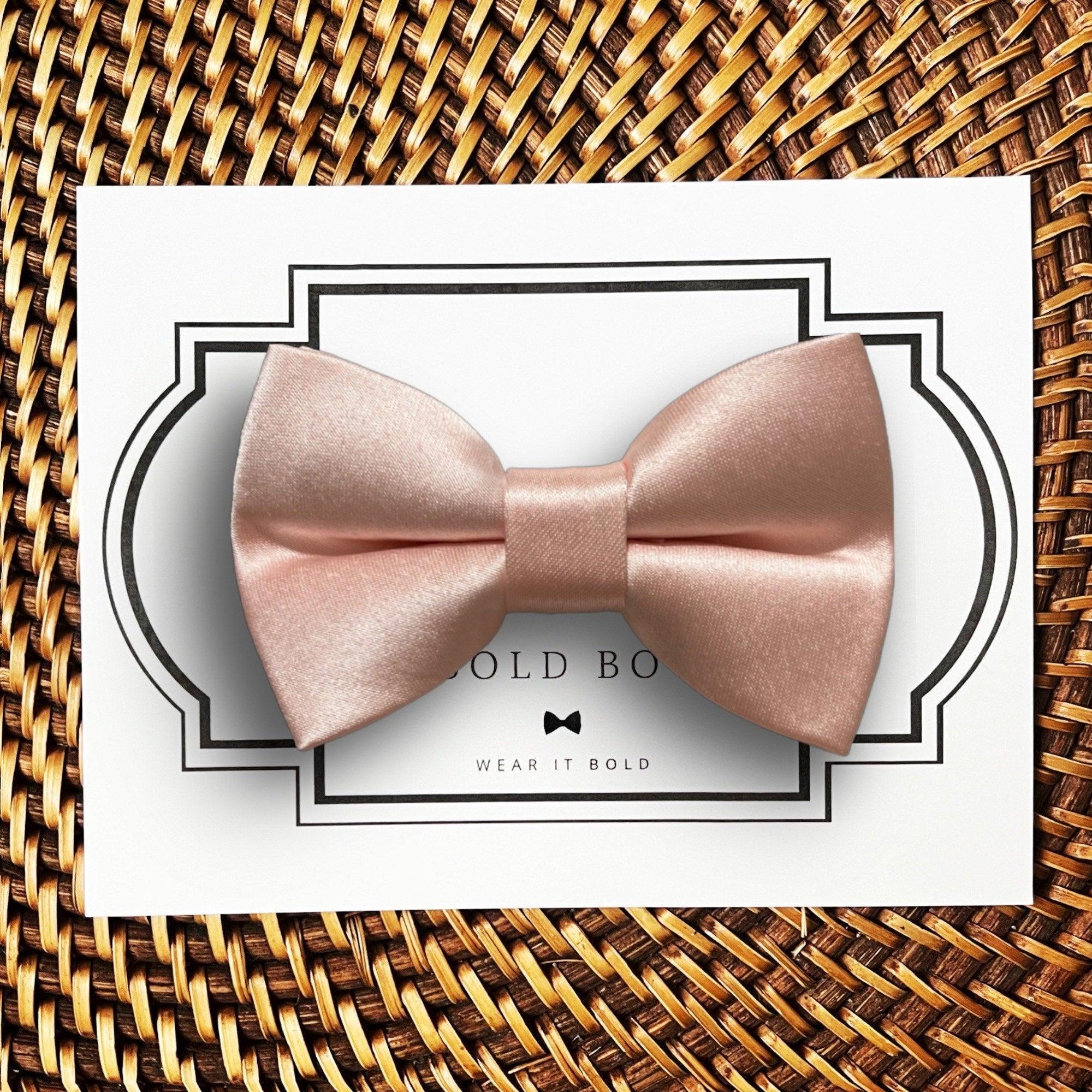 Satin blush bow for dog or cat collars displayed on a white card with a decorative frame