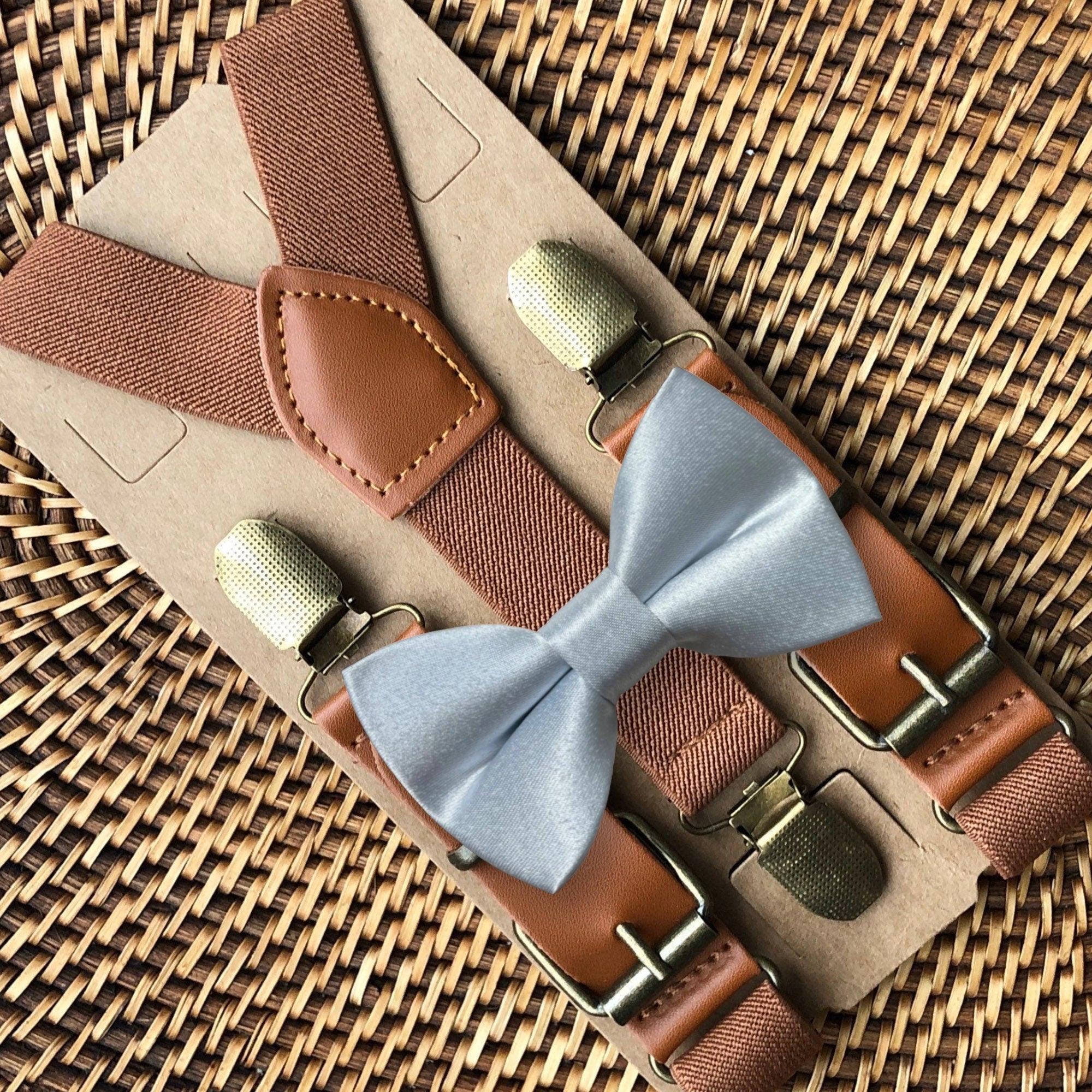 Size chart for suspender and bow tie sets from The Bold Bow Tie. X-Small (6mo-4yr): 15"-23" suspenders, 3.5" bow. Small (5-9yr): 18"-33" suspenders, 3.5" bow. Medium (10-12yr): 18"-33" suspenders, 4" bow. Adult (13yr-6'5"): 30"-53" suspenders, 4.5" bow. Big & Tall (Over 6'5"): 53"+ suspenders, 4.5" bow. Instructions note to measure from the back waistband over the shoulder to the front waistband for a comfortable fit.