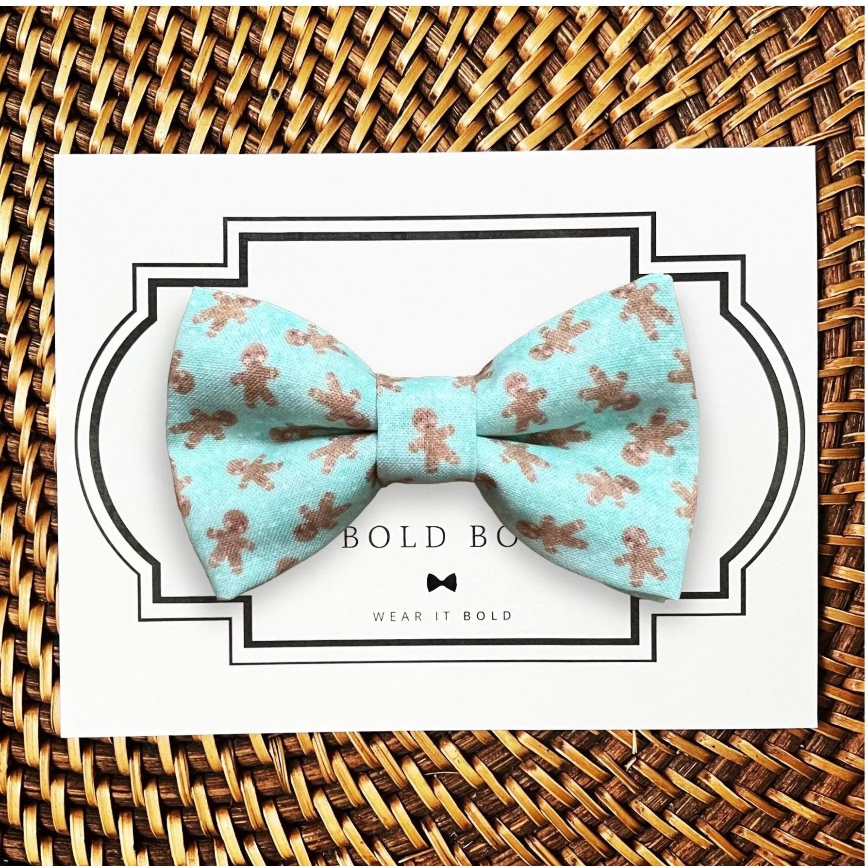 Mint blue gingerbread pattern bow tie for dog or cat collars displayed on a decorative card