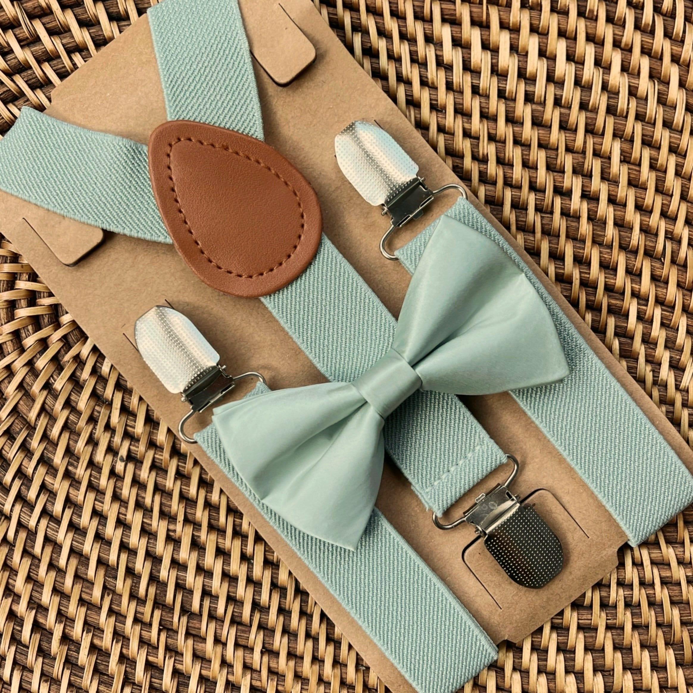 The Bold Bow Tie size chart for bow tie and suspender sets showing Small, Medium, Adult, and Big & Tall sizes with typical age ranges, suspender lengths, and bow tie widths. Small fits ages 6 months–6 years with 18–29 inch suspenders and a 3.5 inch bow tie; Medium fits ages 7–12 years with 25.5–40 inch suspenders and a 4 inch bow tie; Adult fits ages 13 years–6 feet tall with 25.5–40 inch suspenders and a 4.5 inch bow tie; Big & Tall fits over 6 feet tall with 31–53 inch suspenders and a 4.5 inch bow tie.