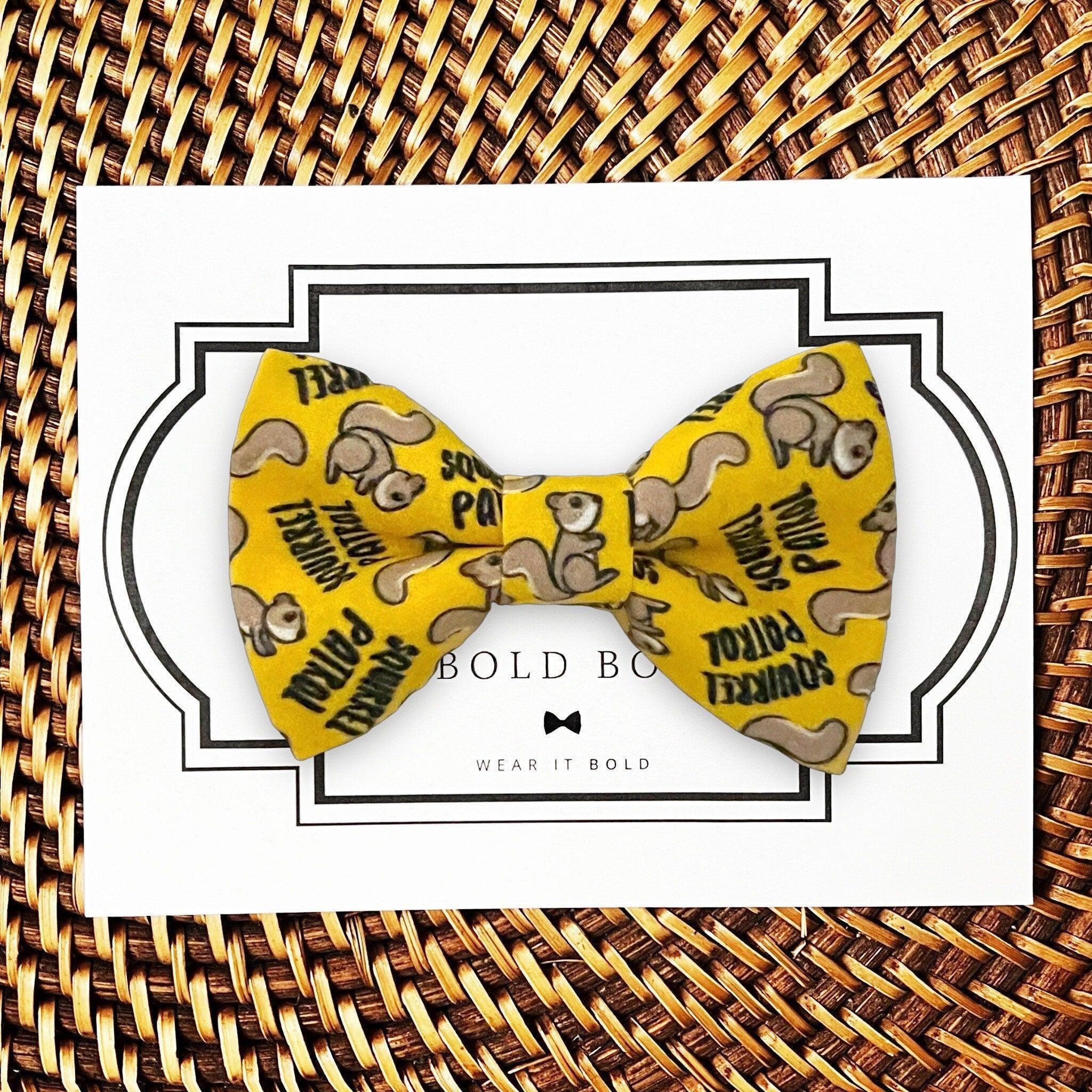 Dog bow tie size chart. Size Small is 3 1/2 inches wide for small dogs under 15 lbs. Size Medium is 4 inches wide for medium dogs between 15 band 40 lbs. Size Large is 4 1/2 inches wide for Large Dogs between 40 band 80 lbs. Size Extra Large is 5 1/2 inches wide for Extra Large Dogs over 80 lbs. Sizing is up to preference and pet bow ties slide on to dog collars with elastic.