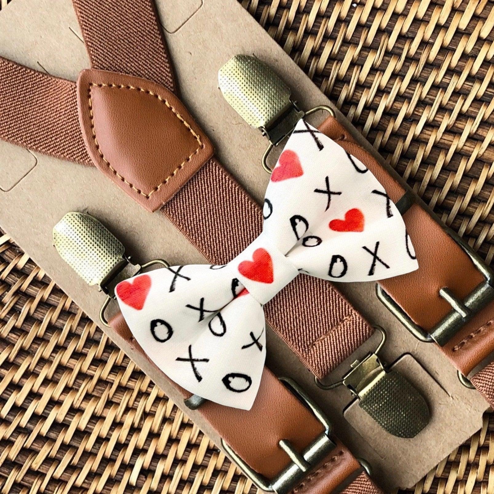Valentine's Day bow tie in white, red hearts and black XO XO and brown suspenders.