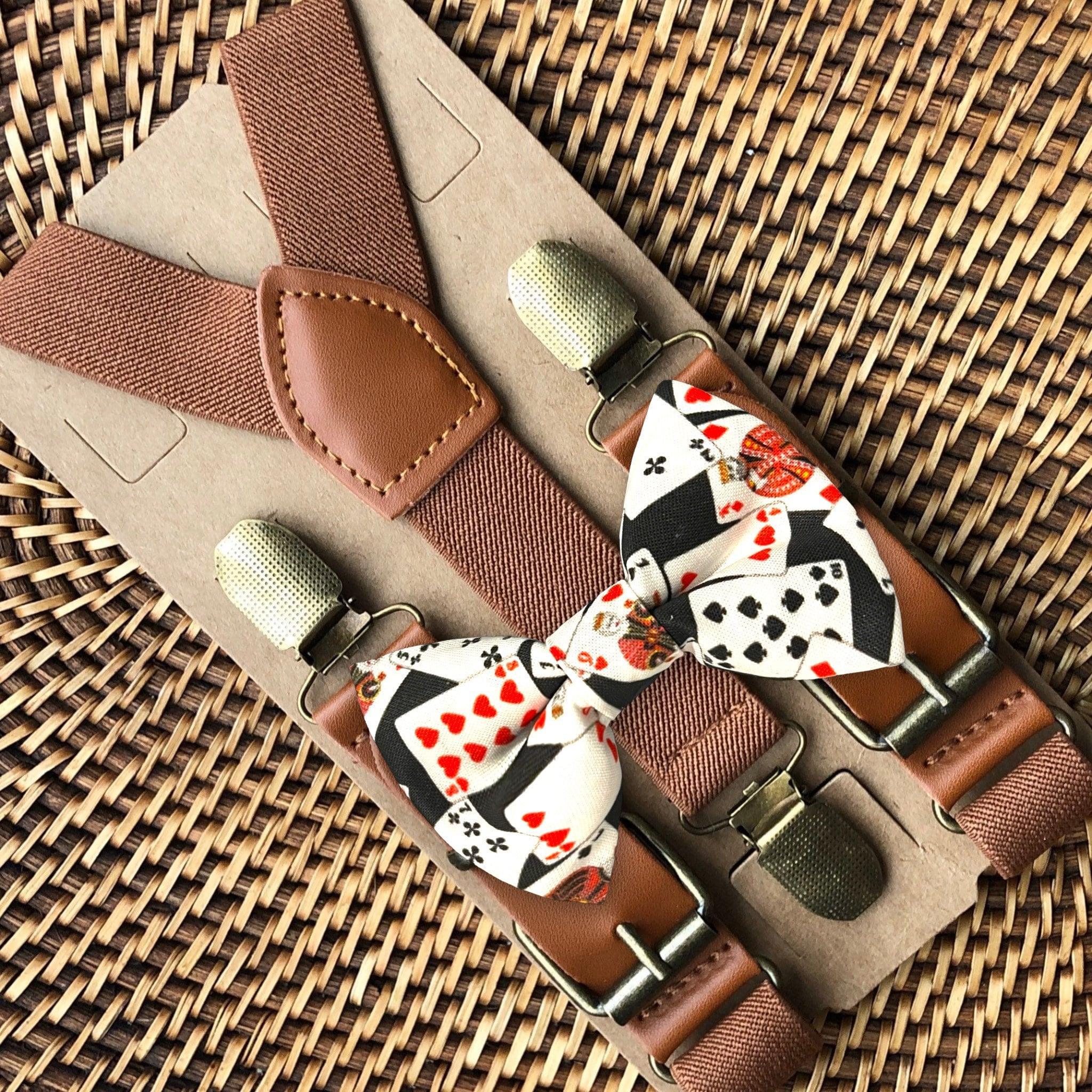 Casino Night Bow Tie and Cognac Buckle Suspenders set displayed on textured brown fabric background