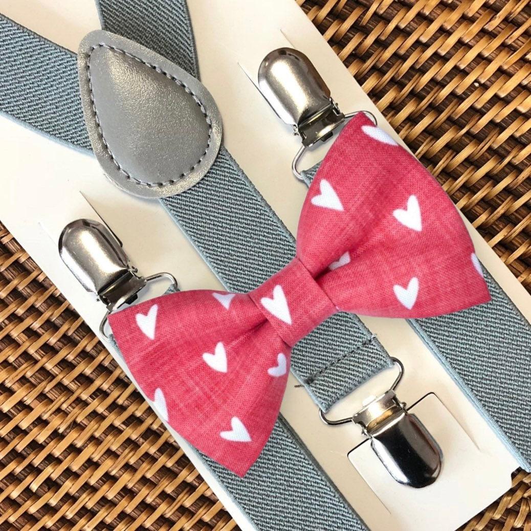 Red Hearts Bow Tie with light gray suspenders and silver clip fasteners on packaging