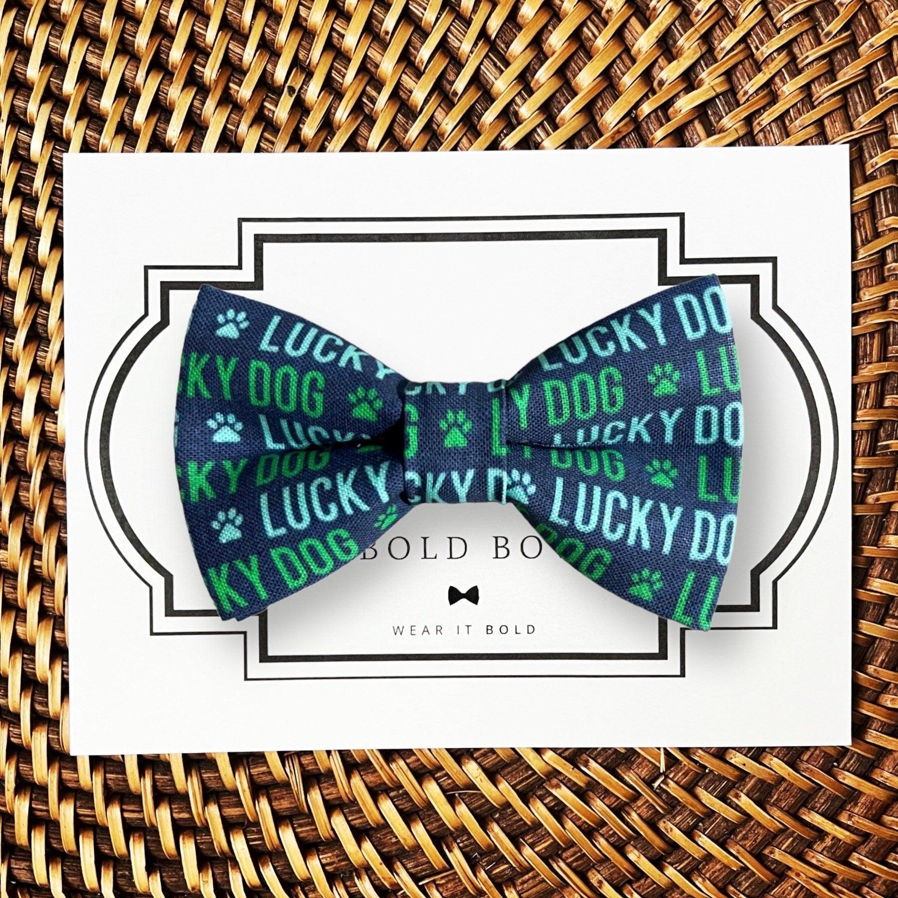 Dog bow tie size chart. Size Small is 3 1/2 inches wide for small dogs under 15 lbs. Size Medium is 4 inches wide for medium dogs between 15 band 40 lbs. Size Large is 4 1/2 inches wide for Large Dogs between 40 band 80 lbs. Size Extra Large is 5 1/2 inches wide for Extra Large Dogs over 80 lbs. Sizing is up to preference and pet bow ties slide on to dog collars with elastic.