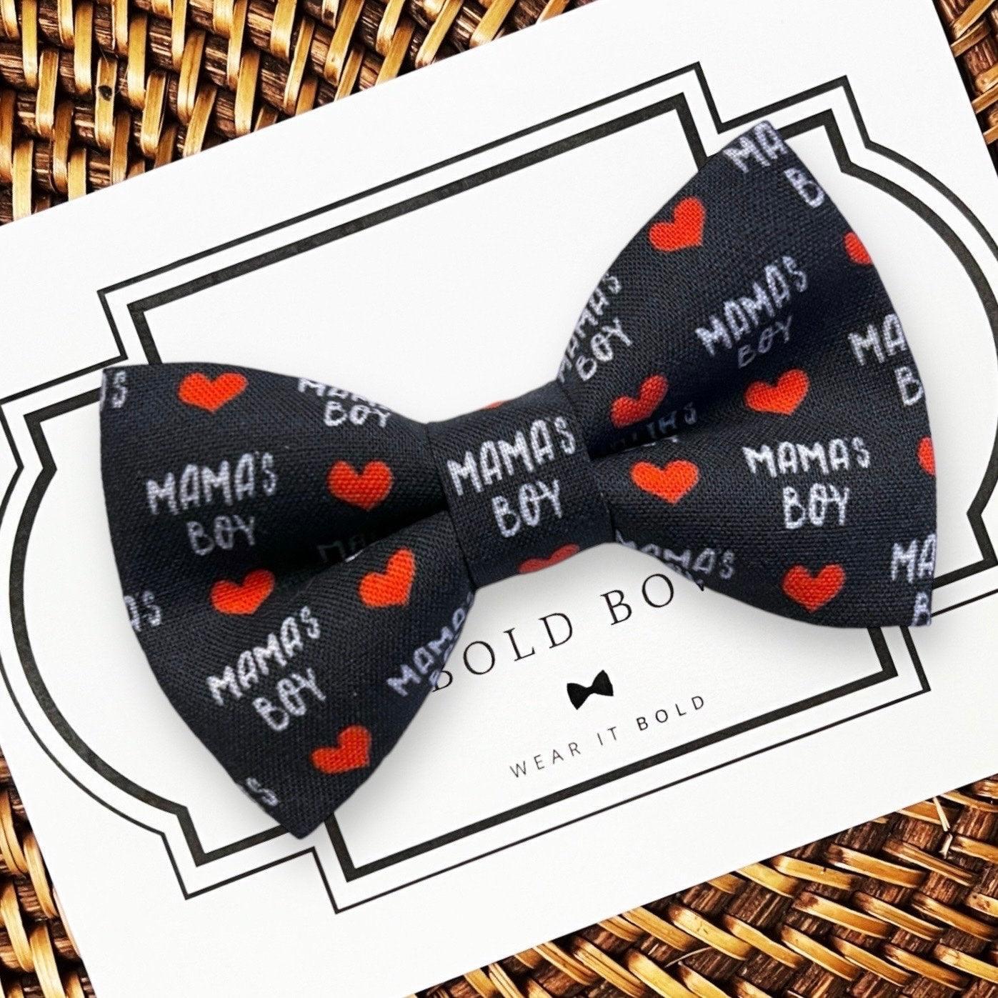 Valentines Day dog bow tie with 'Mama's Boy' text and red hearts on a white card with black border