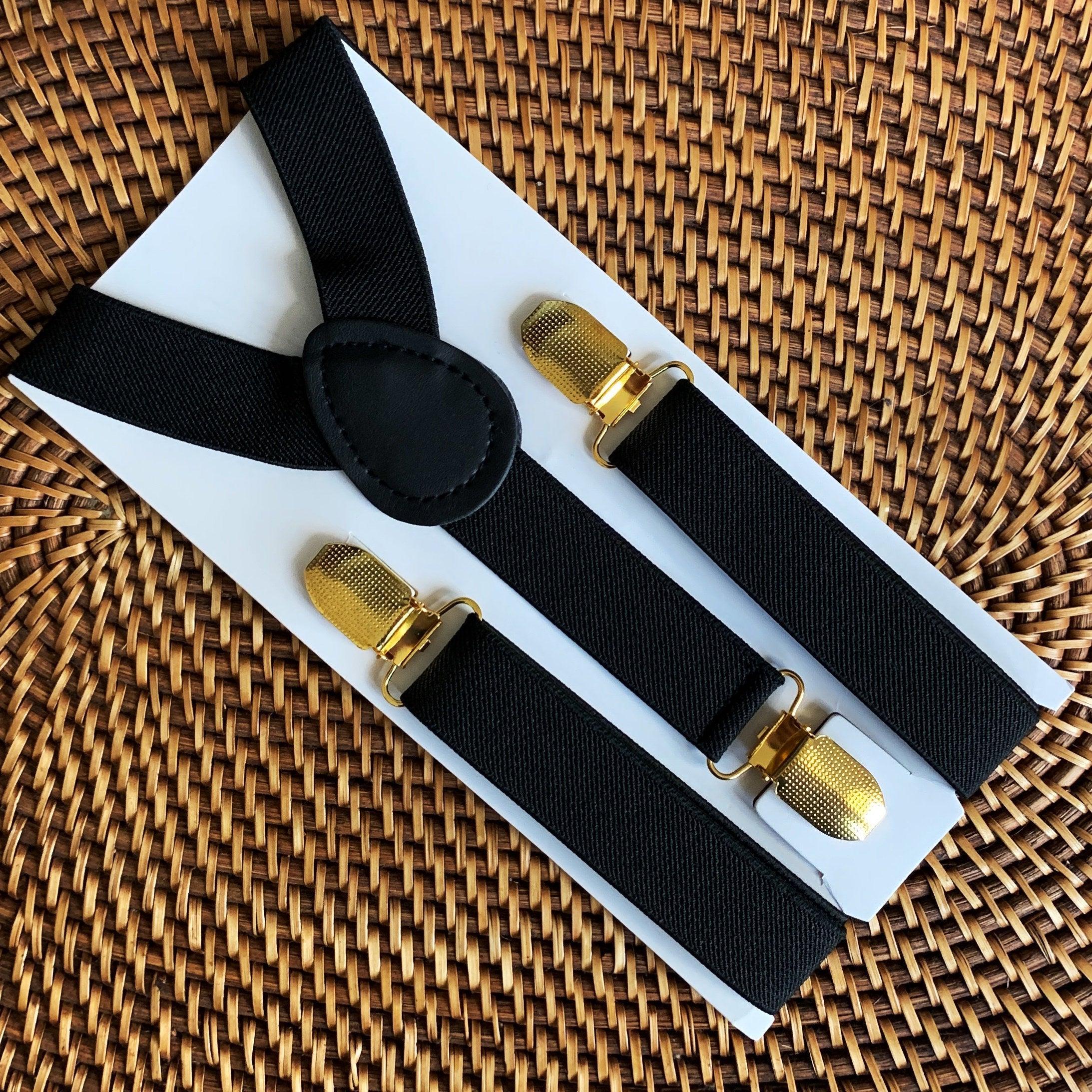 The Bold Bow Tie size chart for bow tie and suspender sets showing Small, Medium, Adult, and Big & Tall sizes with typical age ranges, suspender lengths, and bow tie widths. Small fits ages 6 months–6 years with 18–29 inch suspenders and a 3.5 inch bow tie; Medium fits ages 7–12 years with 25.5–40 inch suspenders and a 4 inch bow tie; Adult fits ages 13 years–6 feet tall with 25.5–40 inch suspenders and a 4.5 inch bow tie; Big & Tall fits over 6 feet tall with 31–53 inch suspenders and a 4.5 inch bow tie.