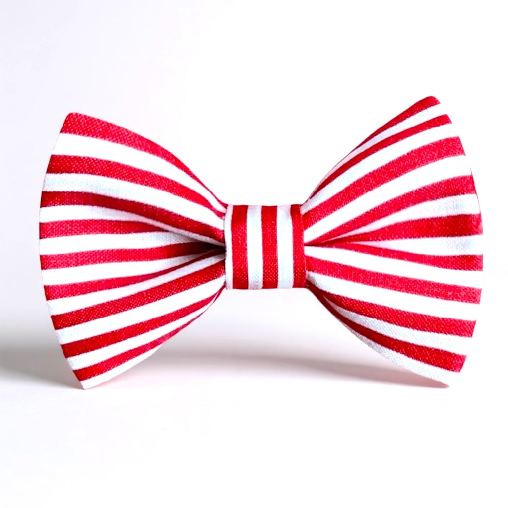 Red and white striped bow tie for men on a white background