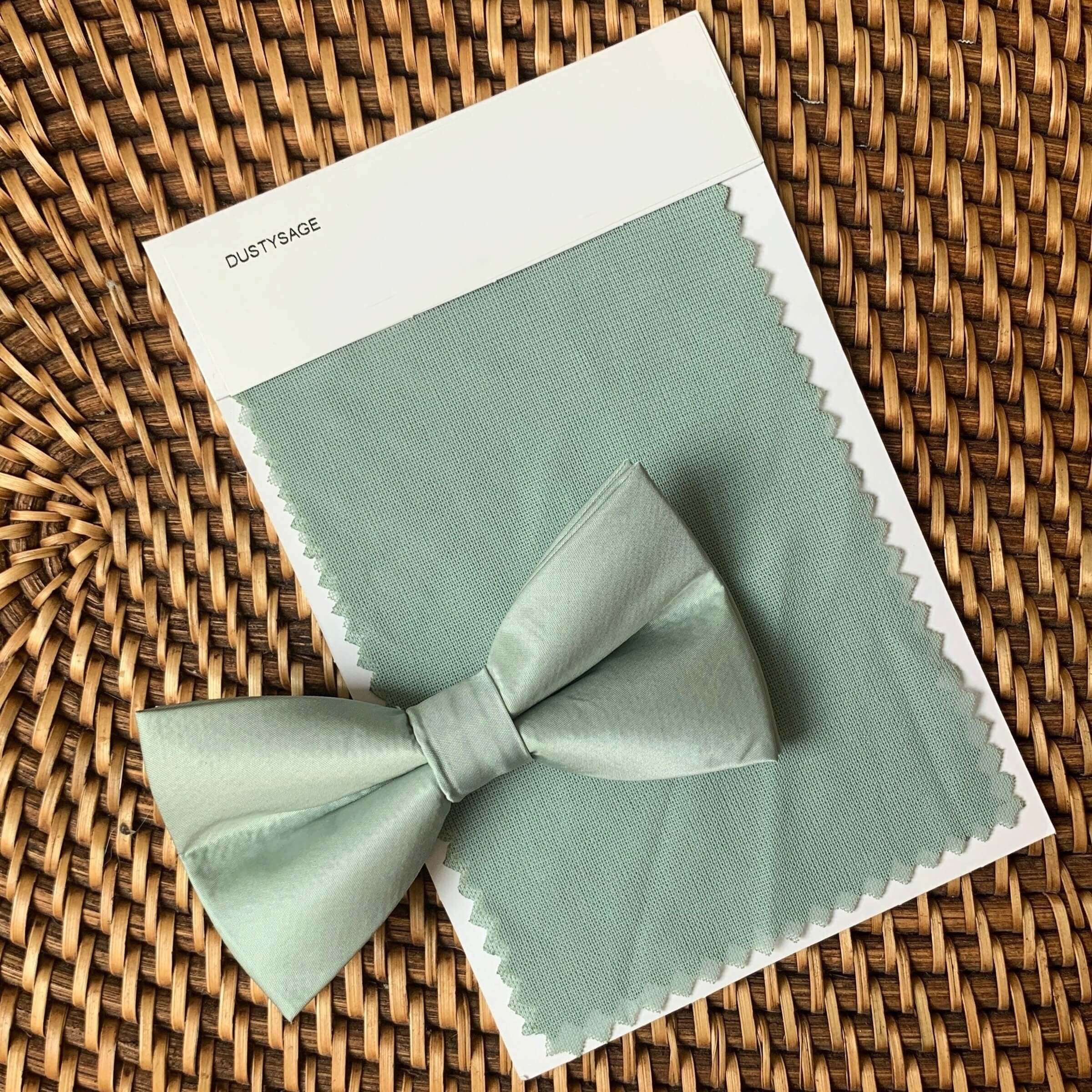 Sage bow tie against a dusty sage swatch. 