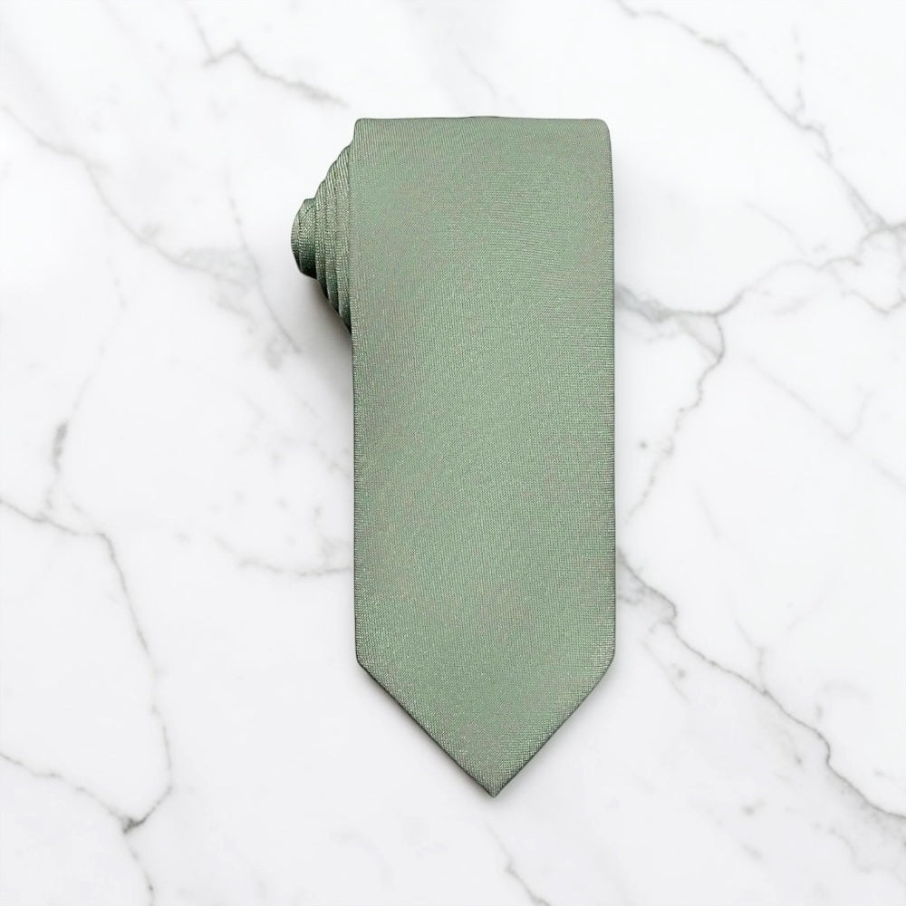 A sage green tie for men’s wedding necktie with a matching fabric neck loop, laid flat on a textured white surface.