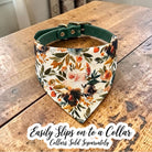 Close up of a dog collar sliding through the pocket of an ivory and terracotta floral pet bandana