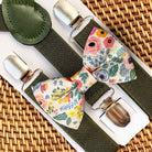 Floral bow tie and suspenders set for a wedding, groomsmen or ring bearer on a woven surface
