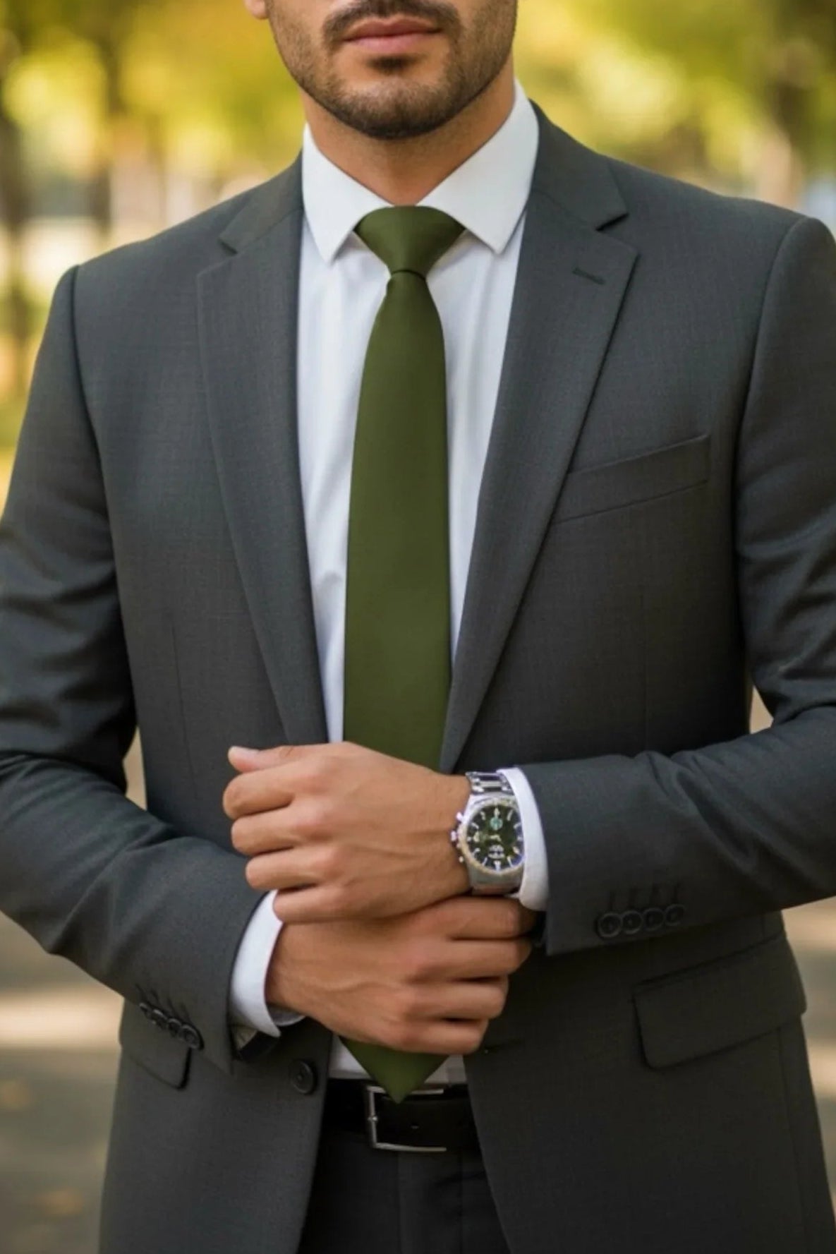 Groomsman at a wedding wearing an olive men’s tie.
