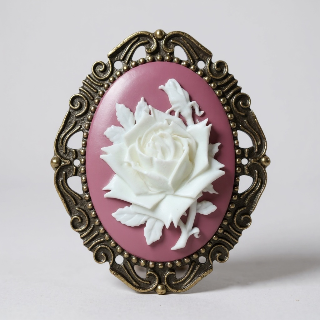 Decorative rose brooch with white rose and bird design on a pink background