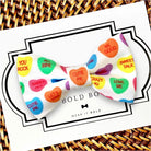Valentines Day dog bow tie with conversation hearts.