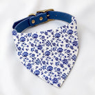 Blue floral dog bandana with a matching blue collar (sold separately) on a white background