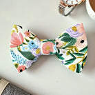 Close-up of a handmade White Floral Pre-Tied Bow Tie with a botanical pattern for wedding attire.